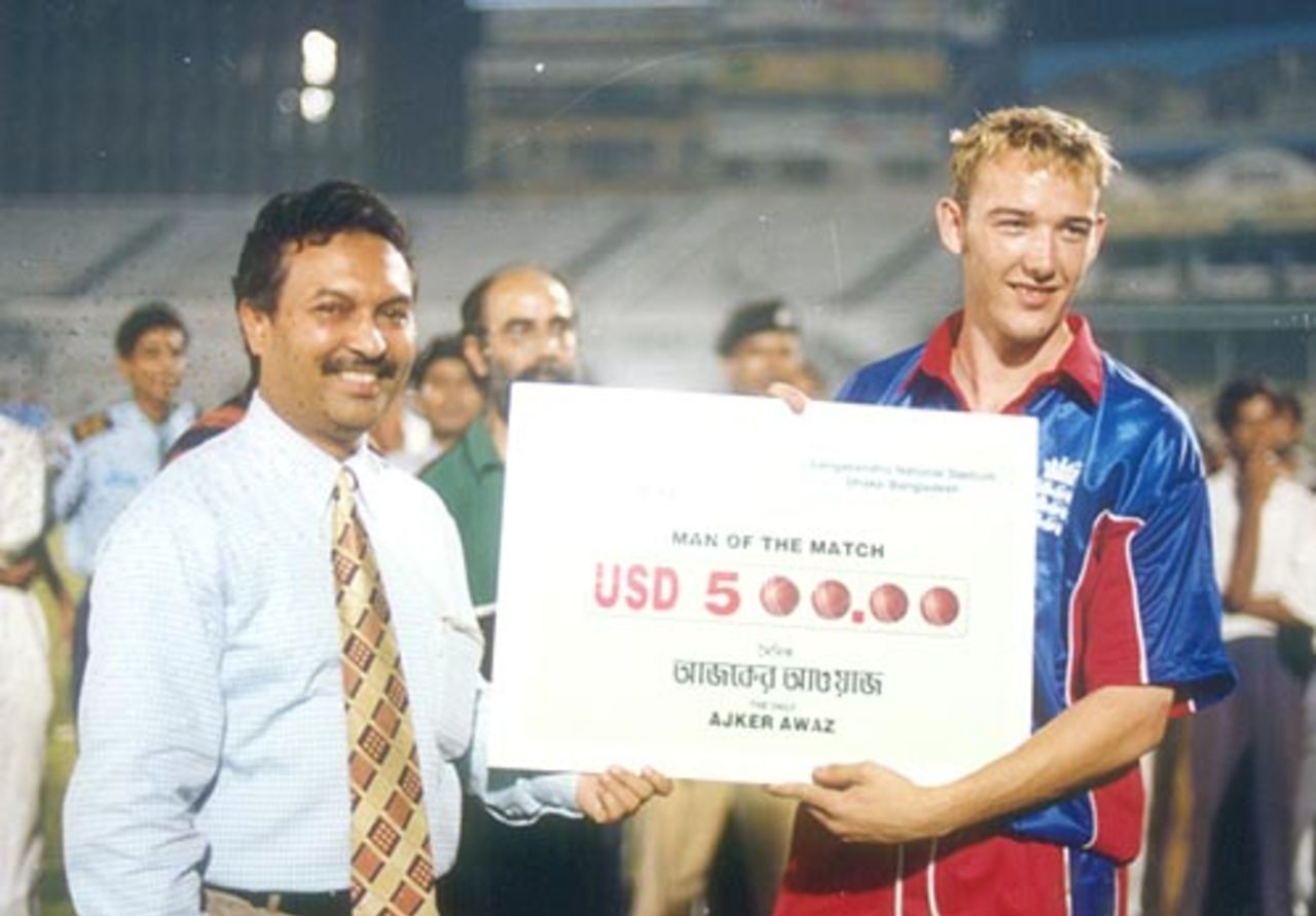 England A leg break bowler CP Schofield receiving the man of the match award at the end of the game against BCA at the Bangabandhu stadium in Dhaka on October 23