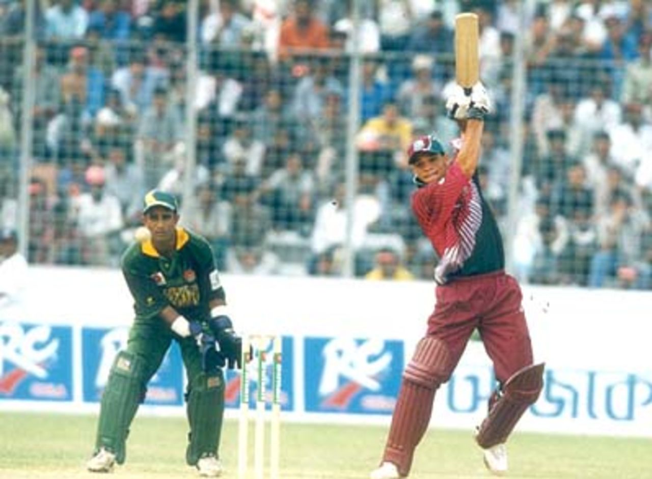 Wicket keeper Mashud watches Powell playing a forcing shot through the covers against Bangladesh, West Indies v Bangladesh (1st ODI) at Bangabandhu National Stadium, Dhaka 08 October 1999, West Indies in Bangladesh 1999/00