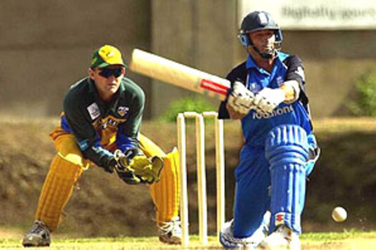 3 Oct 2000: Nasser Hussain the England Captain sweeps the ball past Adam Gilchrist of Australia during the Australia v England friendly One Day game before the ICC Knockout Tournament at the Simba Cricket Ground, Nairobi, Kenya.