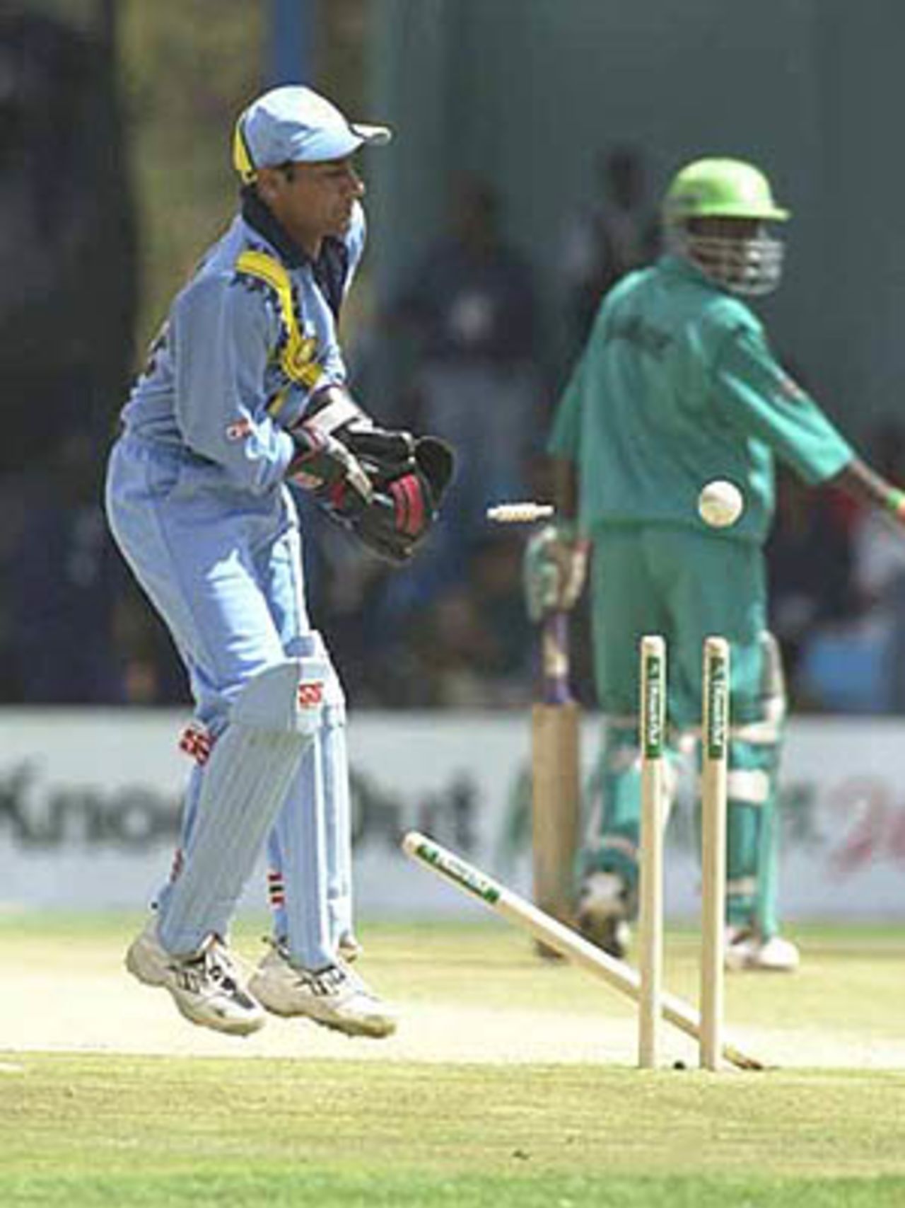 Debutant stumper Vijay Dahiya takes evasive action as a throw leaves the stumps in disarray, ICC KnockOut, 2000/01, Preliminary Quarter Final, Kenya v India, Gymkhana Club Ground, Nairobi, 3 October 2000.