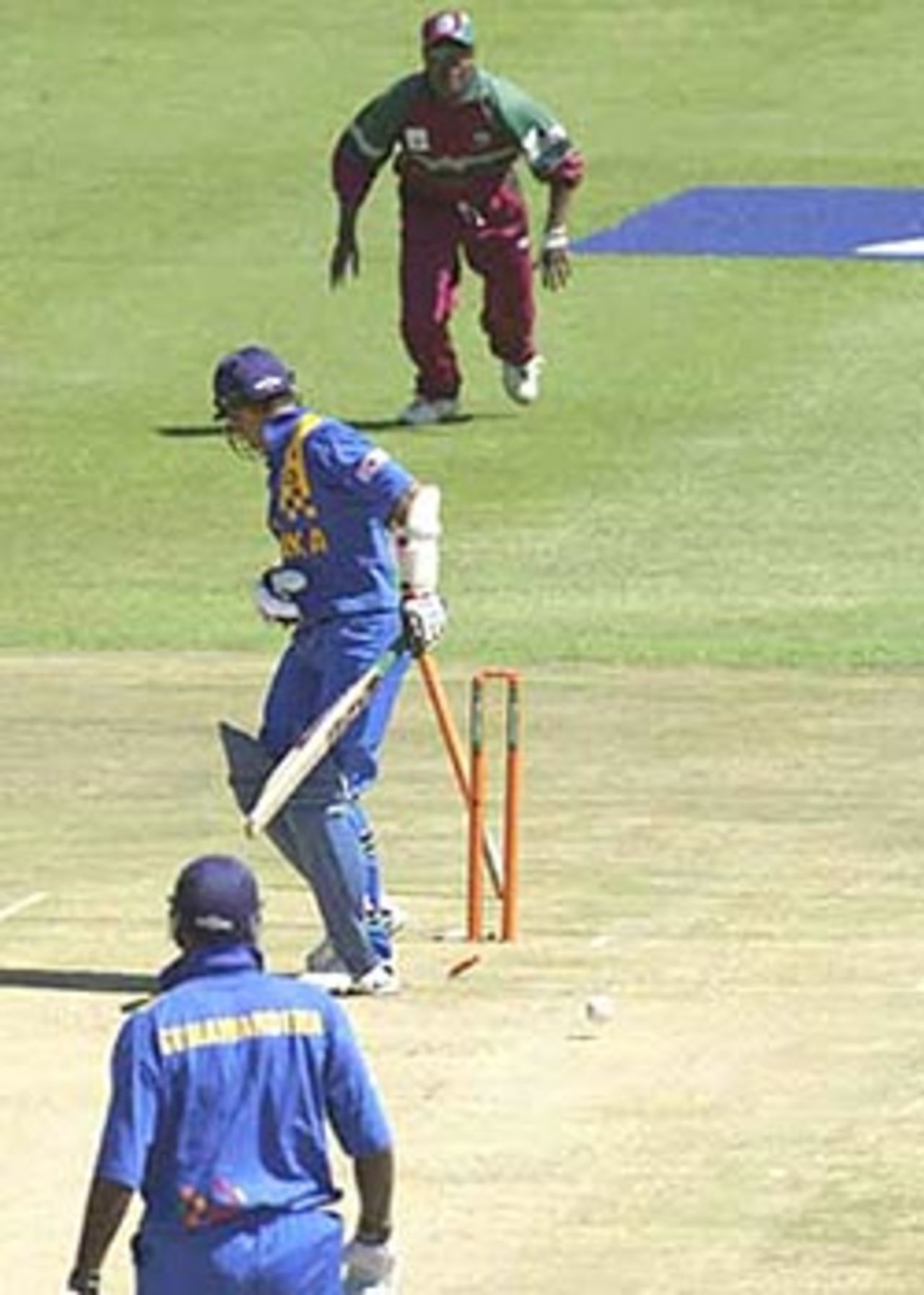 Marvan Atapattu looks back to see his stump uprooted by Dillon, ICC KnockOut, 2000/01, 2nd Preliminary Quarter Final, Sri Lanka v West Indies, Gymkhana Club Ground, Nairobi, 04 October 2000.