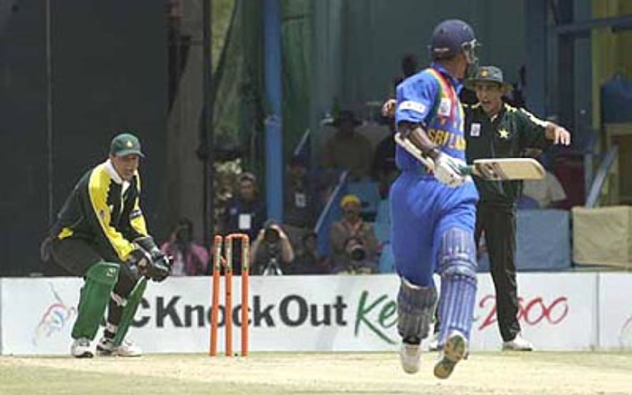 Moin Khan dislodges the bails to run Jayawardene out, ICC KnockOut, 2000/01, 2nd Quarter Final, Pakistan v Sri Lanka, Gymkhana Club Ground, Nairobi, 08 October 2000.
