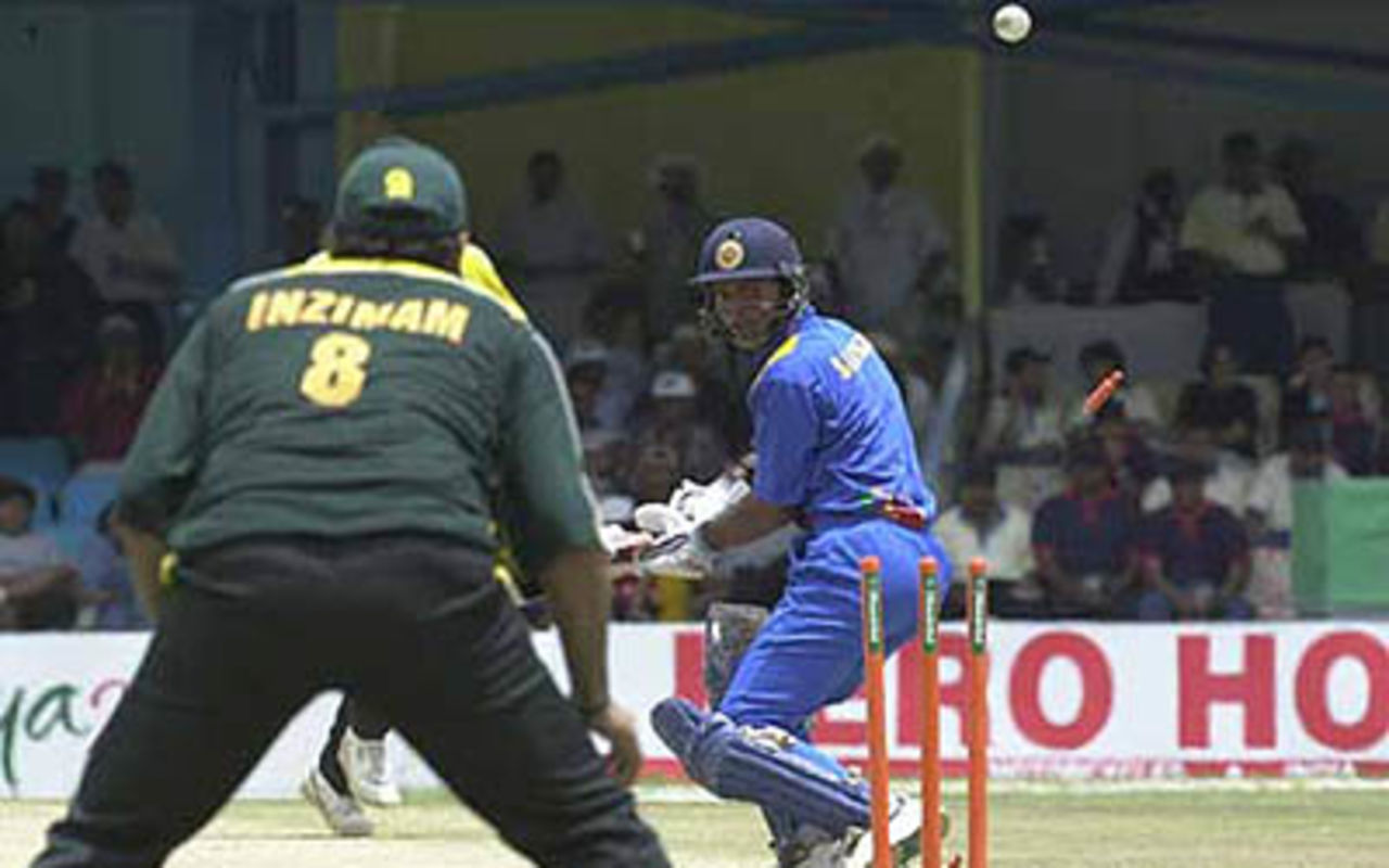 Sangakkara looks back to find his stumps shattered by Abdur Razzaq, ICC KnockOut, 2000/01, 2nd Quarter Final, Pakistan v Sri Lanka, Gymkhana Club Ground, Nairobi, 08 October 2000.