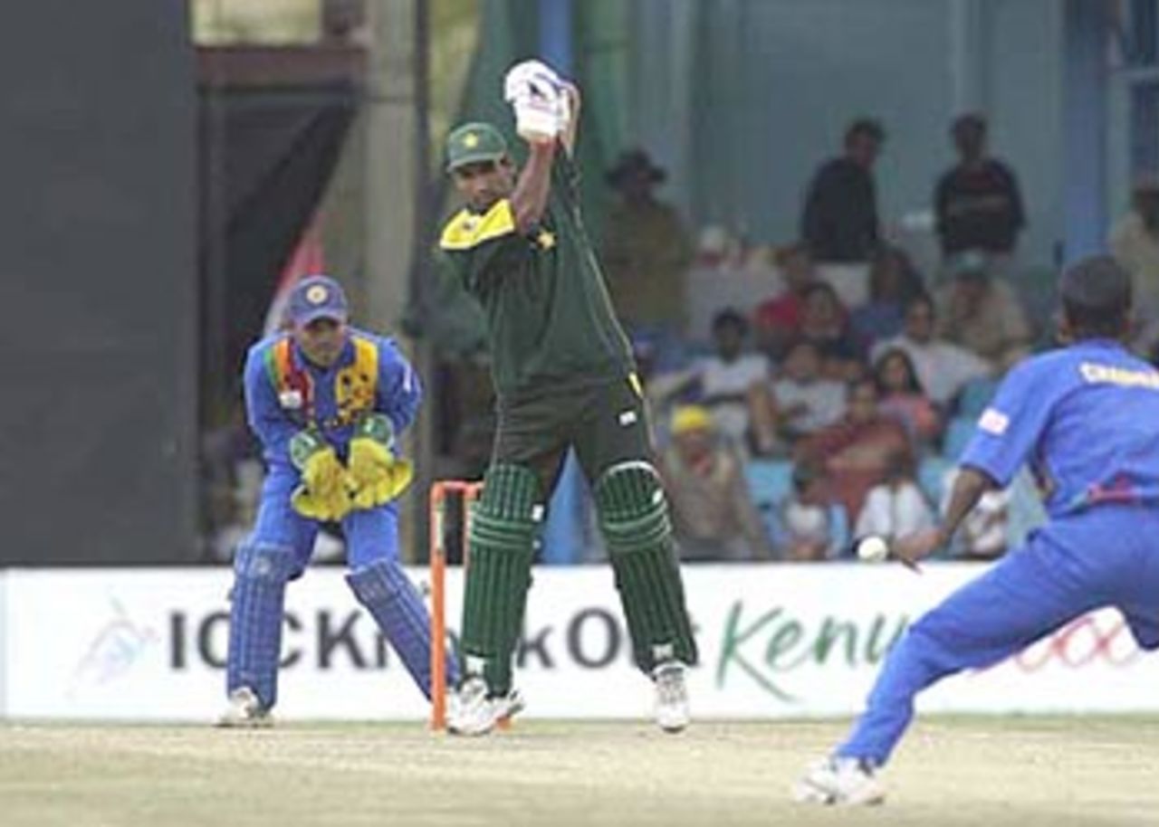 Yousuf Youhana drives the ball off his backfoot straight back to the bowler Upul Chandana, ICC KnockOut, 2000/01, 2nd Quarter Final, Pakistan v Sri Lanka, Gymkhana Club Ground, Nairobi, 08 October 2000.