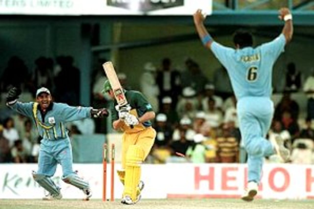 7 Oct 2000: Damien Martyn of Australia is bowled out by Robin Singh of India during the Australia v India second round match of the ICC Knockout tournament at the Gymkhana Club Ground, Nairobi, Kenya.