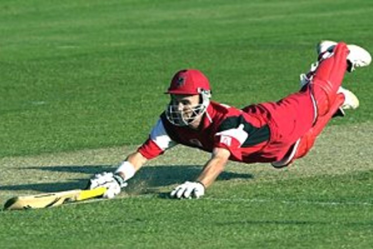 08 Oct 2000: Jeff Vaughan of South Australia dives for the crease to just survive a run out attempt against Queensland during the Mercantile Mutual Cup match played between Queensland and South Australia at Allan Border Field in Brisbane, Australia.