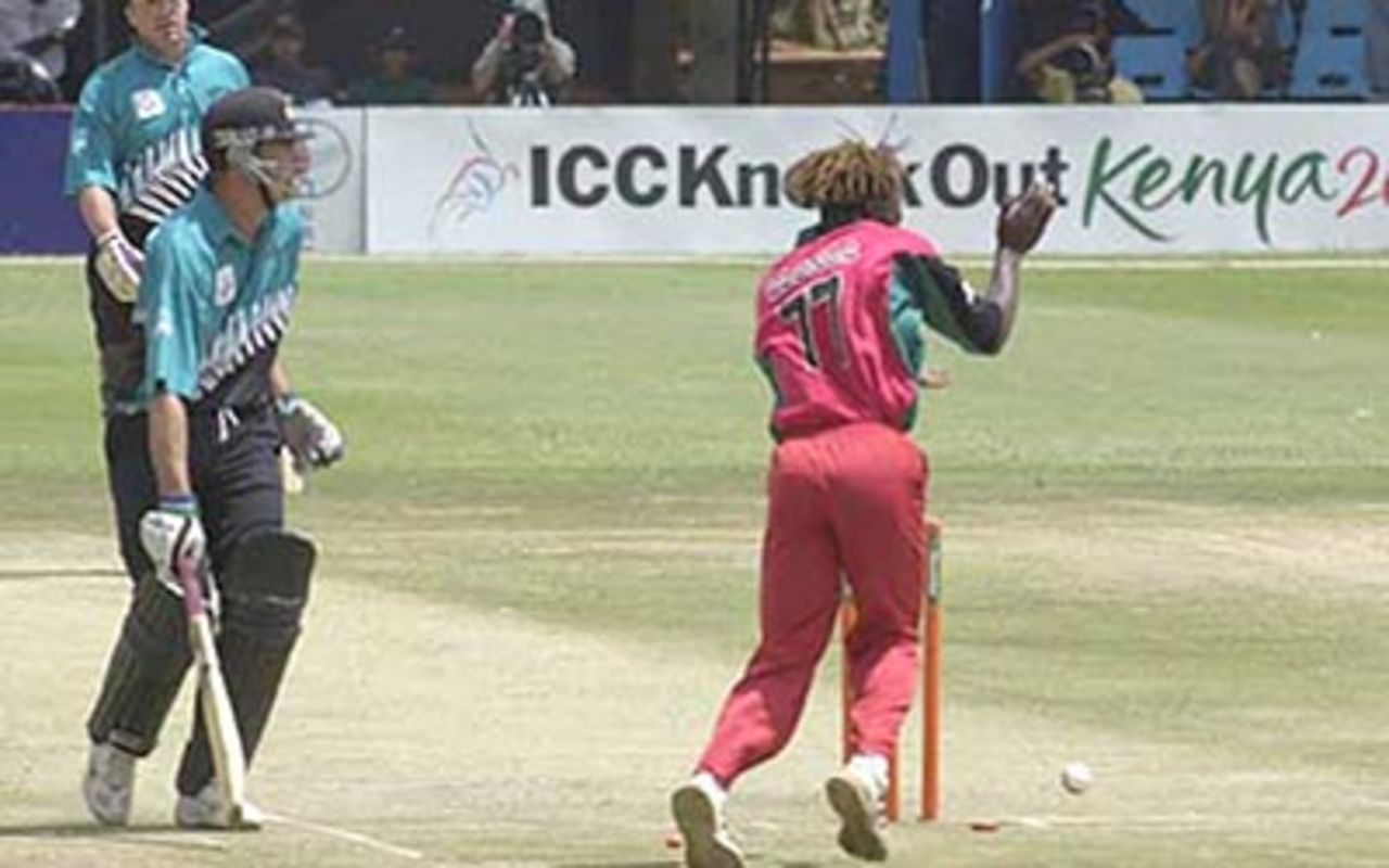 Fleming returns to the crease before Henry Olonga can collect the ball, ICC KnockOut, 2000/01, 3rd Quarter Final, New Zealand v Zimbabwe, Gymkhana Club Ground, Nairobi, 09 October 2000.