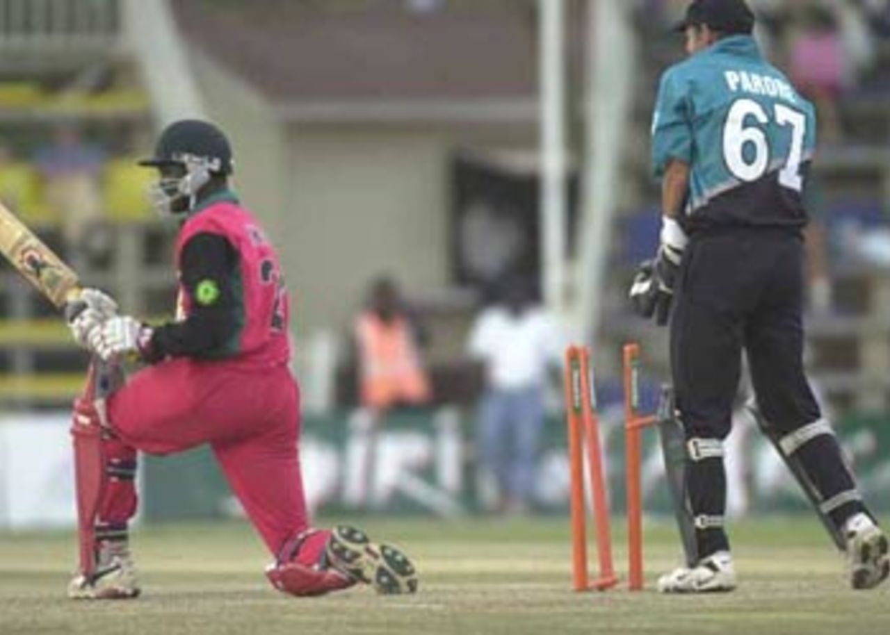 Mluleki Nkala is bowled trying to sweep the ball. ICC KnockOut, 2000/01, 3rd Quarter Final, New Zealand v Zimbabwe, Gymkhana Club Ground, Nairobi,09 October 2000.