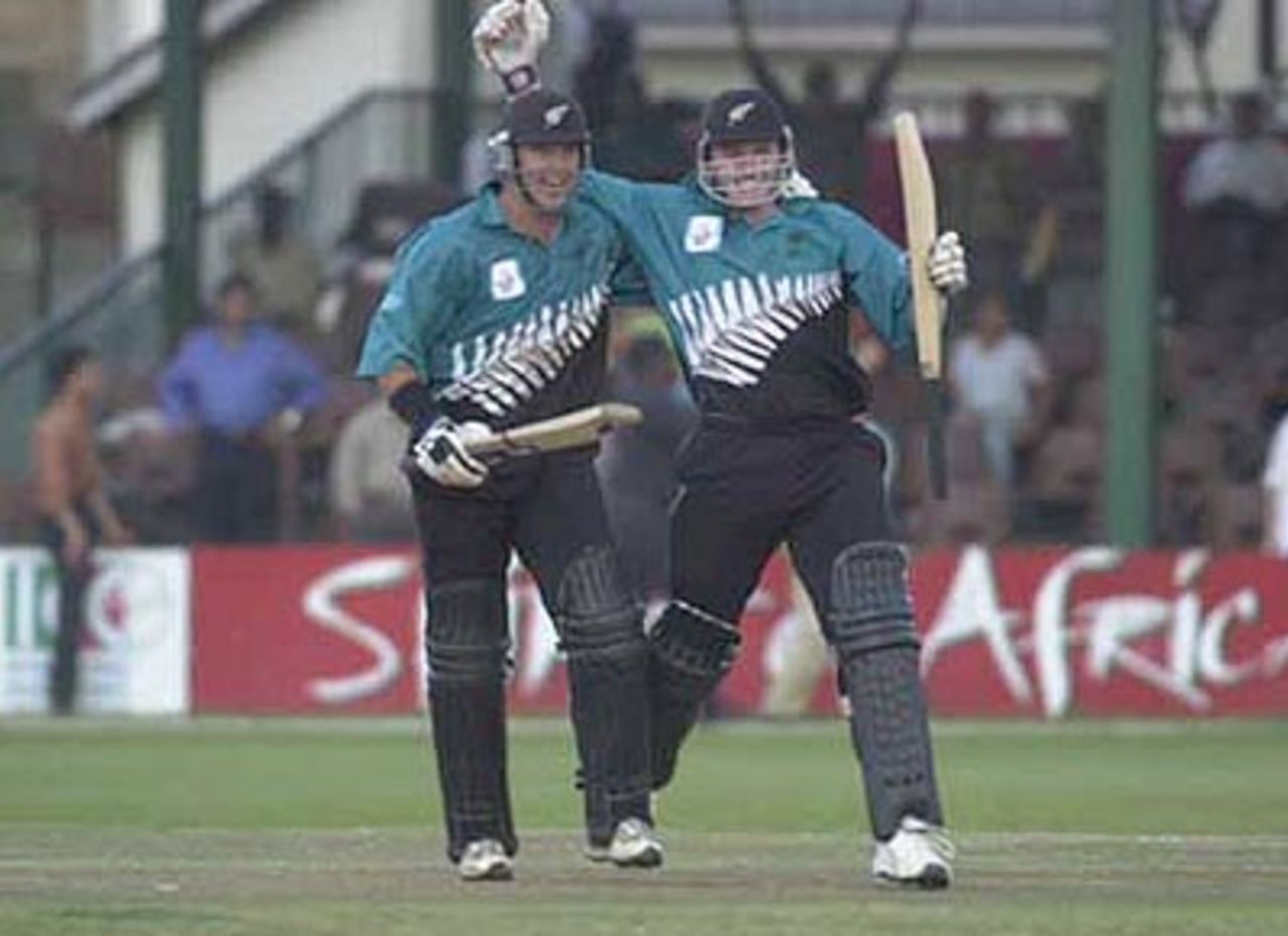 McMillan and Styris celebrate New Zealand's victory over Pakistan. ICC KnockOut 2000/01, 1st Semi Final, New Zealand v Pakistan, Gymkhana Club Ground, Nairobi, 11 October 2000