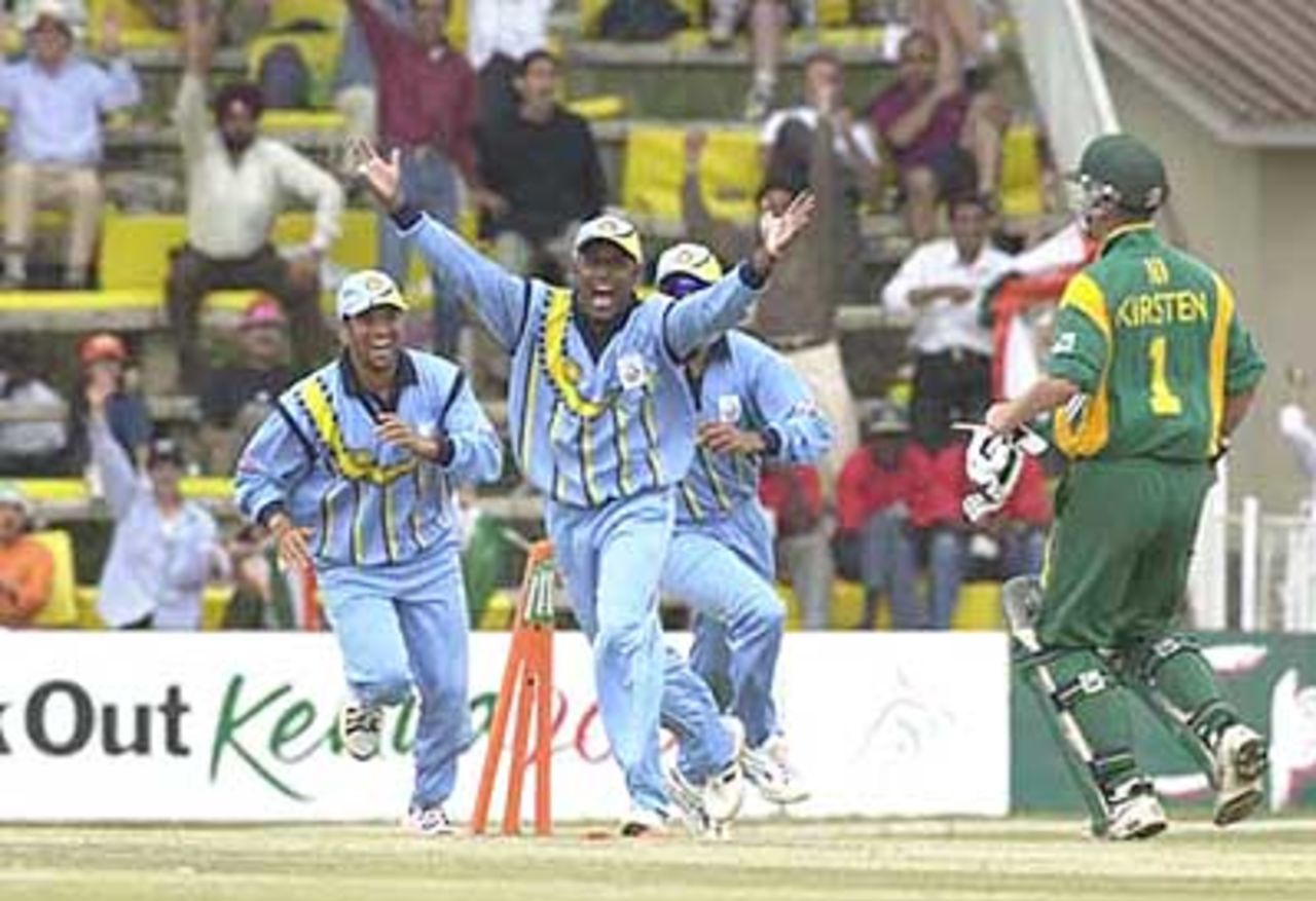 Indians celebrate as Kirsten fails to reach his crease. ICC KnockOut 2000/01, 2nd Semi Final, India v South Africa, Gymkhana Club Ground, Nairobi, 13 October 2000