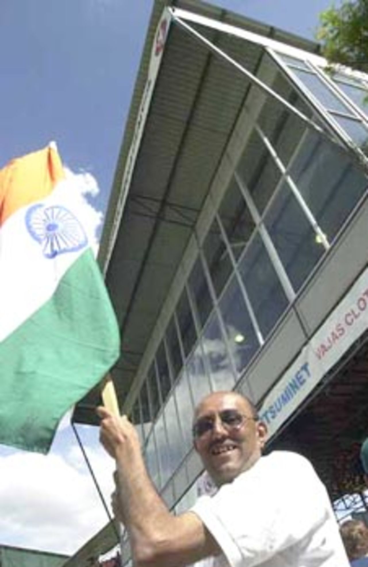 A overjoyed Indian fan waves the tri-colour. ICC KnockOut 2000/01, 2nd Semi Final, India v South Africa, Gymkhana Club Ground, Nairobi, 13 October 2000