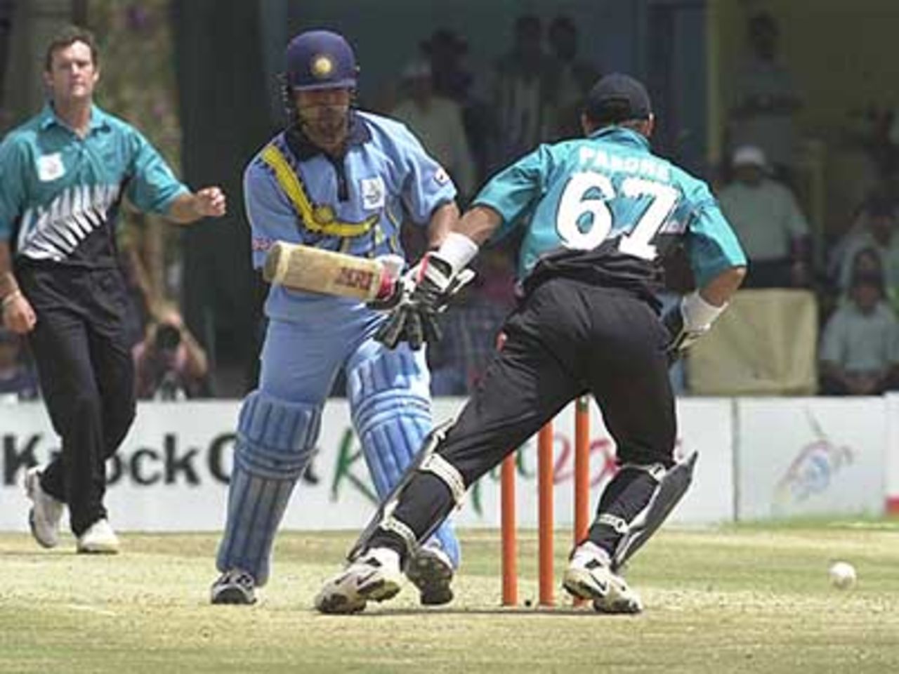Sachin Tendulkar turns back to regain his ground as Parore and Astle watch, ICC KnockOut, 2000/01, Final, India v New Zealand, Gymkhana Club Ground, Nairobi, 15 October 2000.