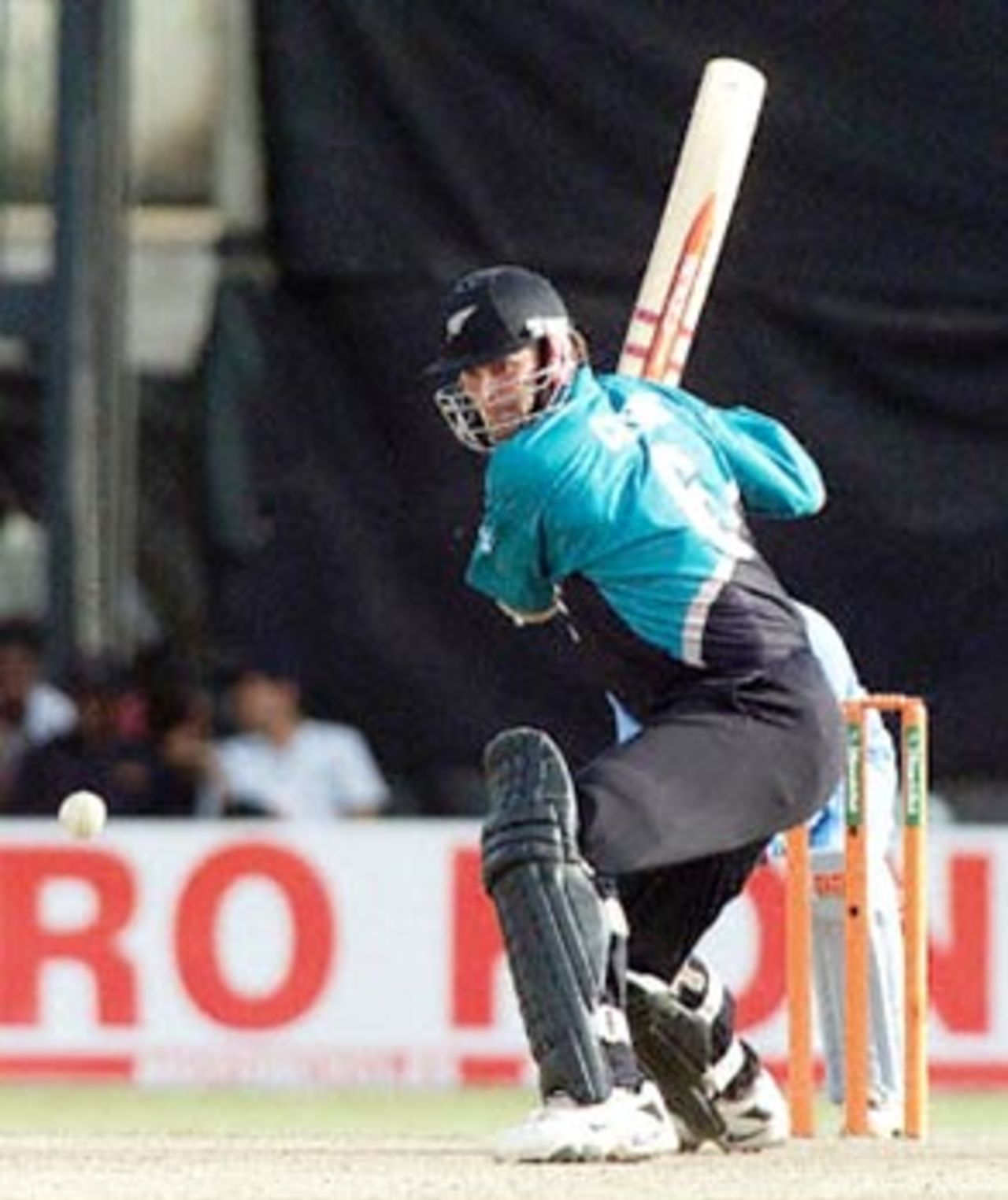 Centurion Cairns sets himself to heave the ball over the infield. ICC KnockOut 2000/01, Final, India v New Zealand, Gymkhana Club Ground, Nairobi 15 October 2000