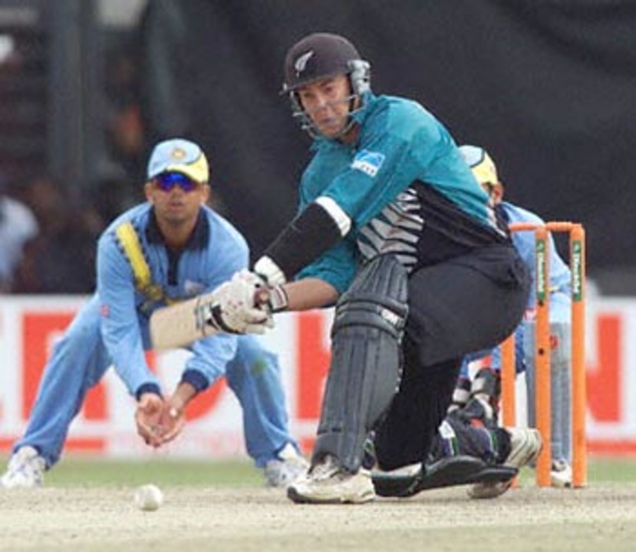 McMillan plays the sweep shot to good effect as Dravid and Dahiya watch. ICC KnockOut 2000/01, Final, India v New Zealand, Gymkhana Club Ground, Nairobi 15 October 2000