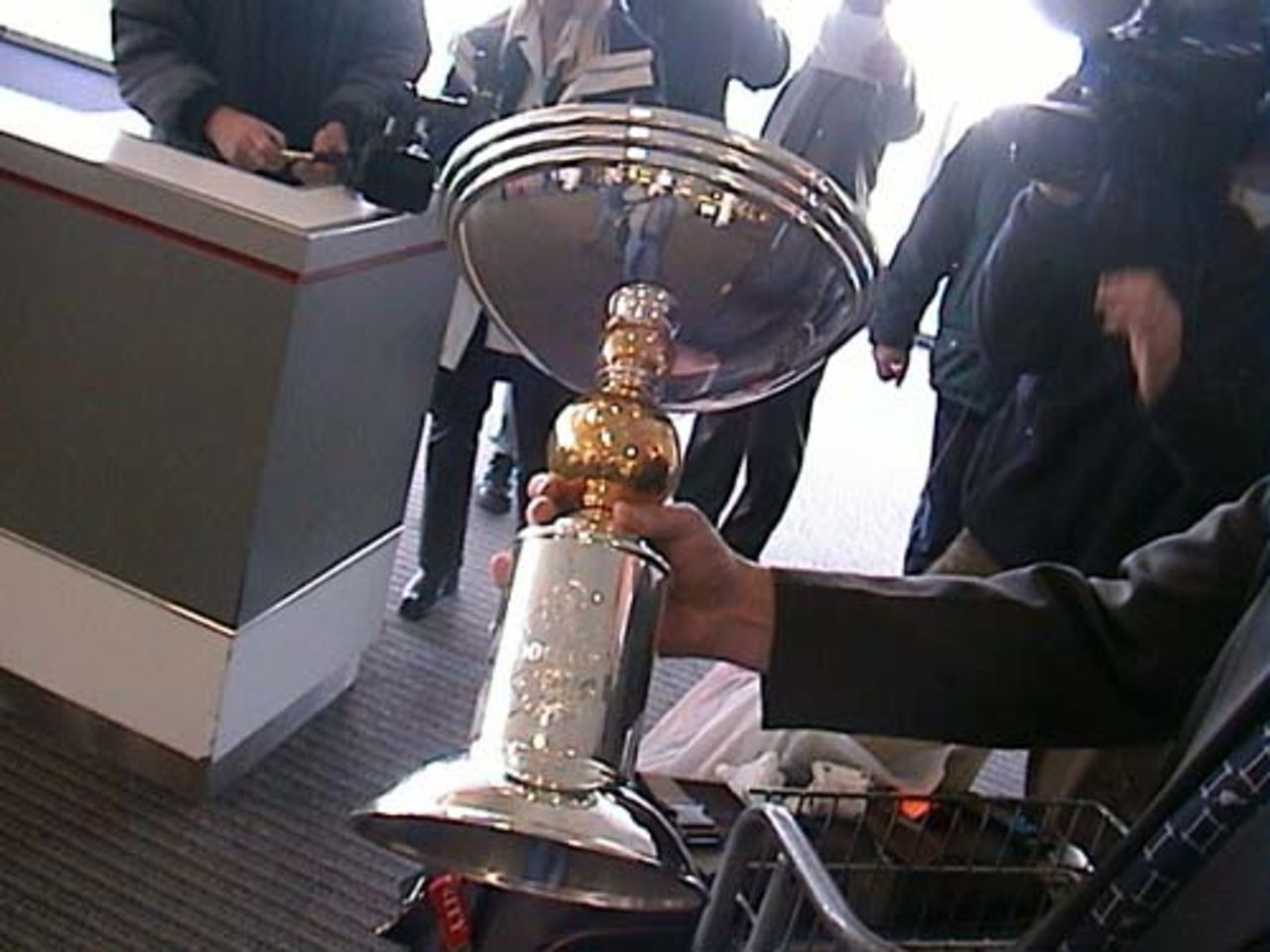 New Zealand Cricket administration manager Tim Murdoch holds the ICC KnockOut trophy, won by New Zealand who defeated India in the final at Nairobi, Kenya, at Christchurch International Airport, 18 October 2000