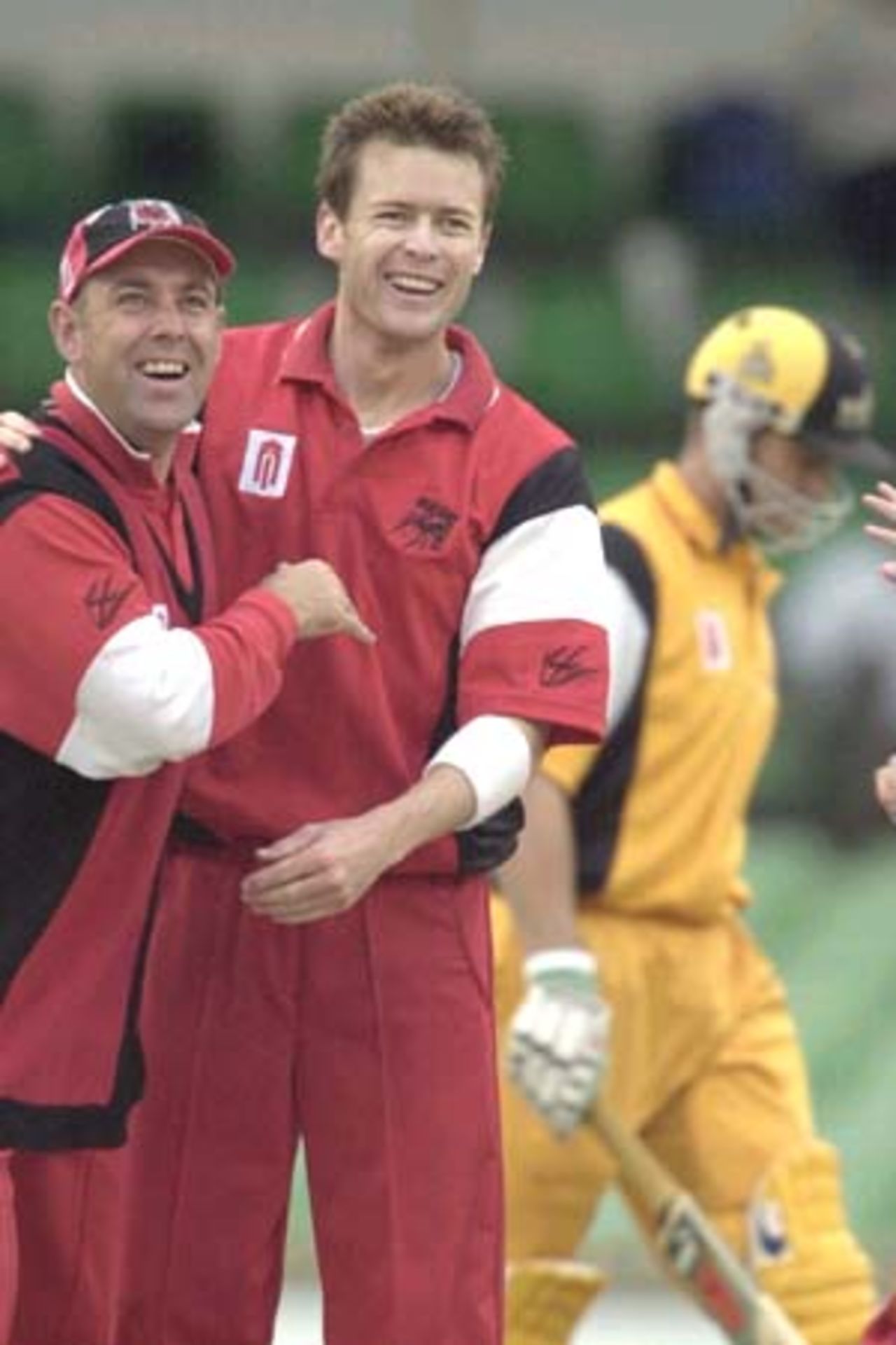 20 Oct 2000: Adam Gilchrist leaves the field for Western Australia as Darren Lehmann (l) and Brett Swain celebrate for South Australia in the Mercantile Mutual Cup match between the Western Australian Warriors and South Australian Redbacks at the WACA ground in Perth Australia. Gilchrist was dismissed caught David Fitzgerald bowled Brett Swain for18.