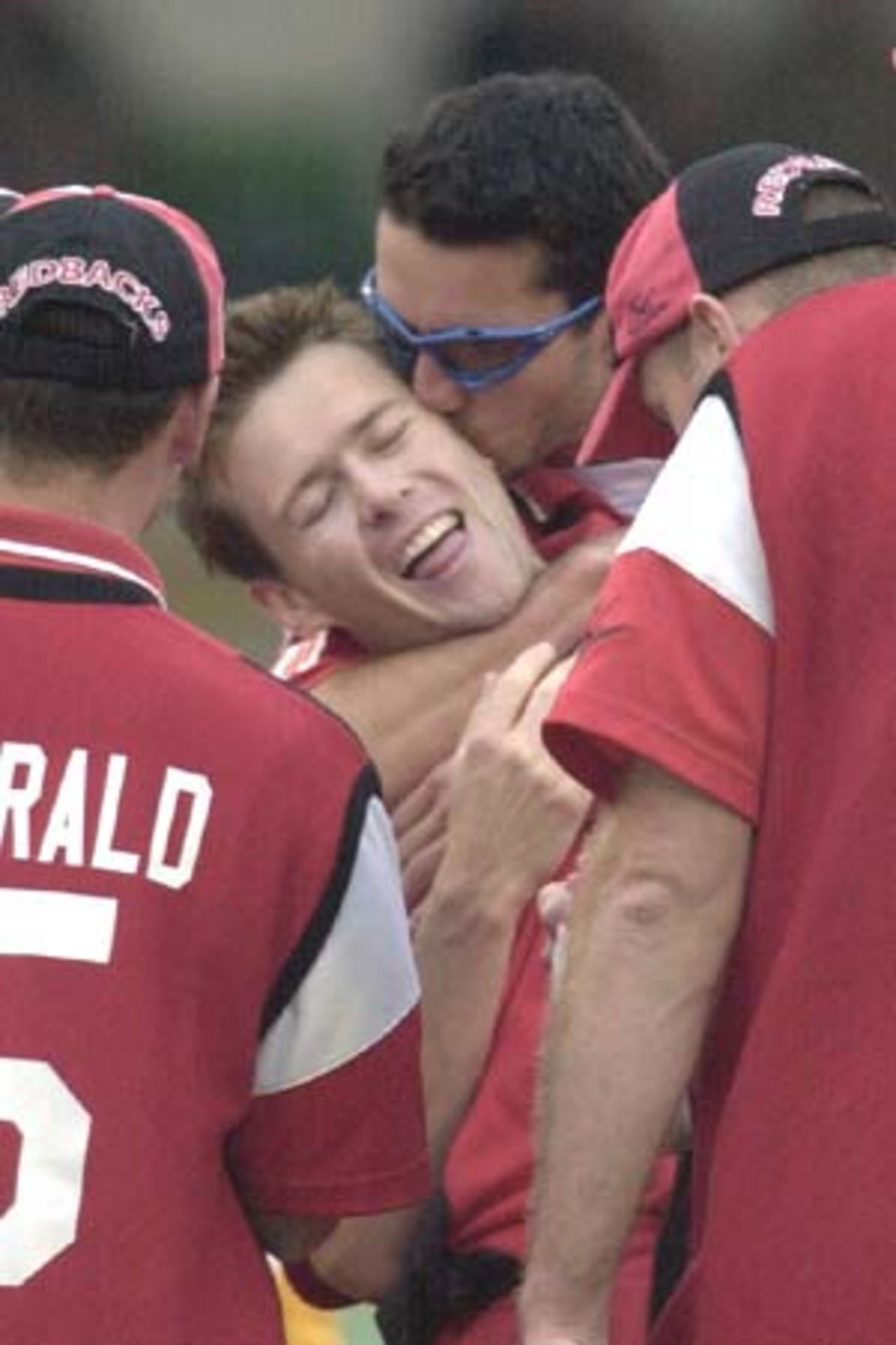 20 Oct 2000: Brett Swain (l) gets a kiss from team-mate Jason Gillespie of South Australia after claiming the wicket of Adam Gilchrist for 18 in the Mercantile Mutual Cup match between the Western Australian Warriors and South Australian Redbacks at the WACA ground in Perth, Australia.