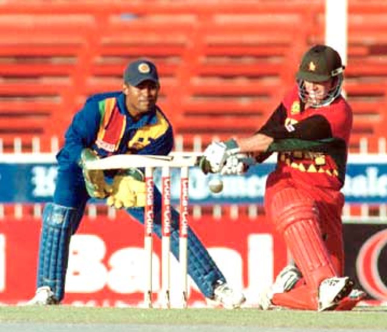 Viljoen playing the sweep shot. Coca-Cola Champions Trophy 2000/01, 2nd Match, Sri Lanka v Zimbabwe Sharjah C.A. Stadium, 21 October 2000