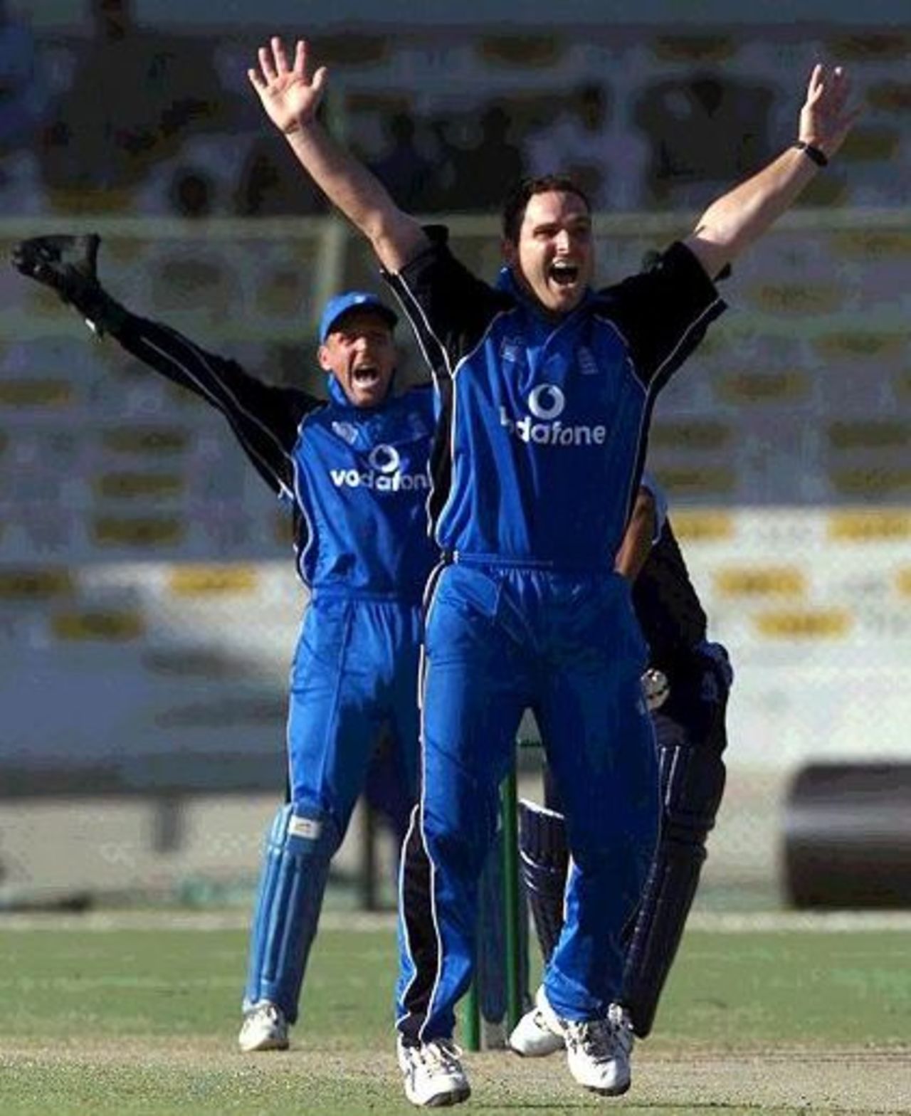 22 Oct 2000: Mark Ealham and Alec Stewart of England put in an appeal against Pakistan A during the during the one day game between Pakistan A and England at the National Stadium in Karachi, Pakistan.