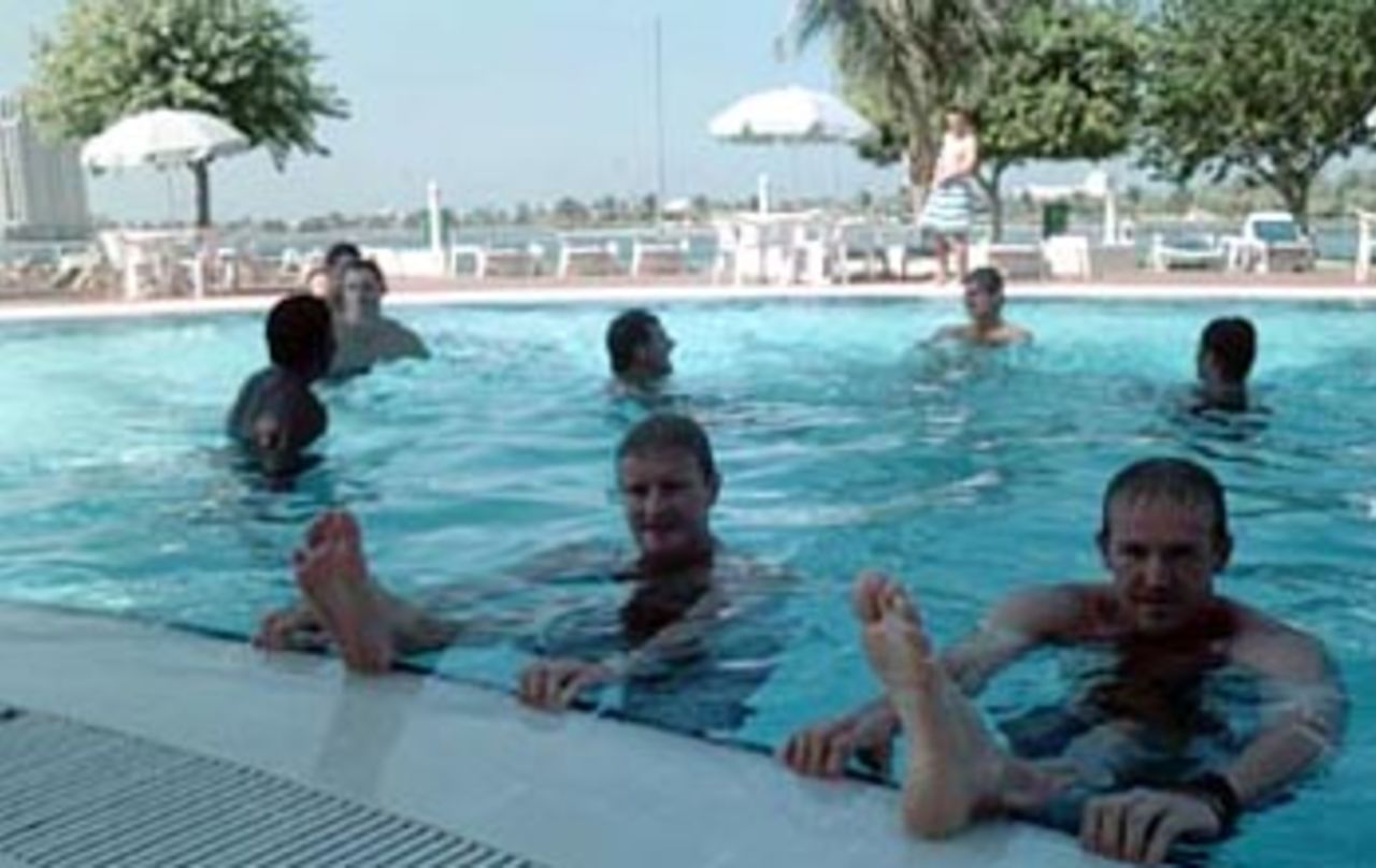 The Zimbabwe team cooling off in the pool. Coca-Cola Champions Trophy 2000/01, 3rd Match, India v Zimbabwe, Sharjah C.A. Stadium, 22 October 2000