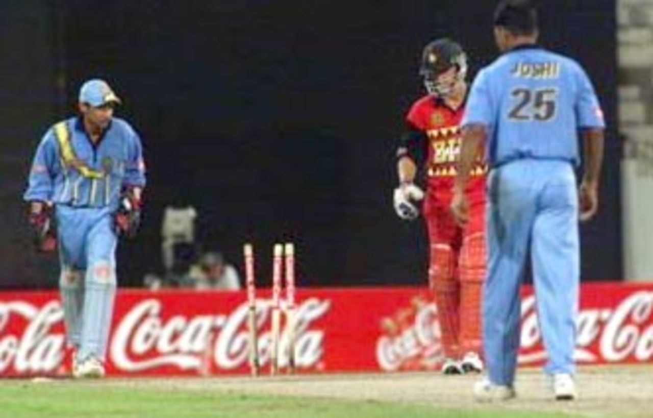 Carlisle on his way back to the pavilion after bowled by Joshi. Coca-Cola Champions Trophy 2000/01, 3rd Match, India v Zimbabwe, Sharjah C.A. Stadium, 22 October 2000