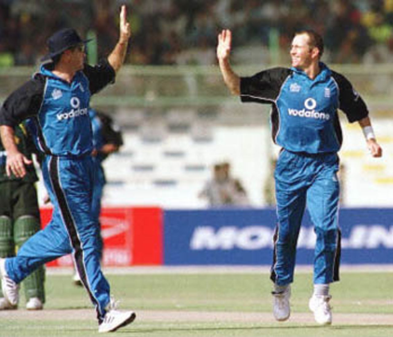 Craig White and Graeme Hick celebrate the fall of Saeed Anwar, England in Pakistan, 2000/01, 1st One-Day International, Pakistan v England, National Stadium, Karachi, 24 October 2000.