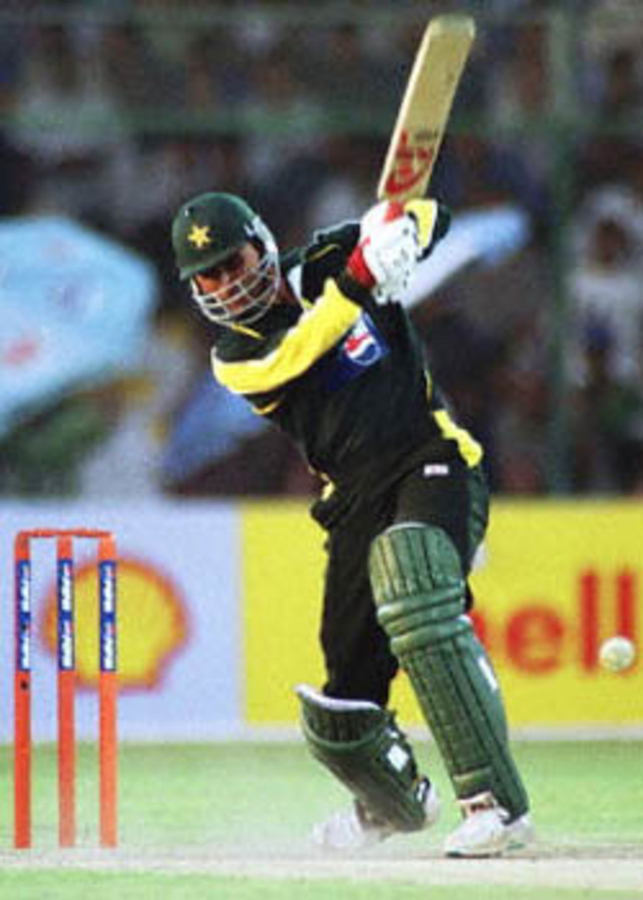 Abdur Razzaq launches into a drive off Darren Gough, England in Pakistan, 2000/01, 1st One-Day International, Pakistan v England, National Stadium, Karachi, 24 October 2000.