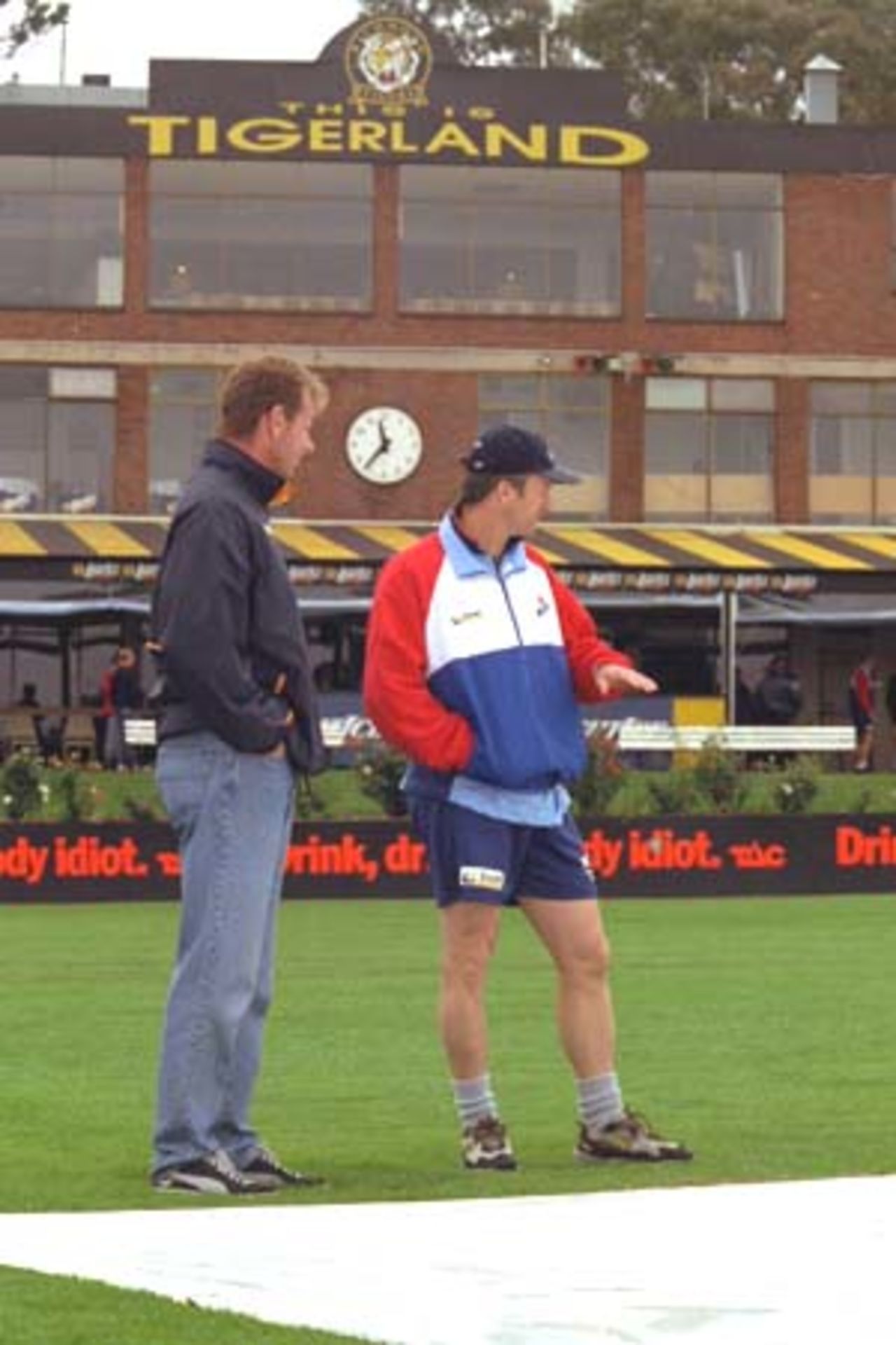 25 Oct 2000: Opposing Captains Paul Reifel of Victoria and Steve Waugh of New South Wales inspect the wicket area at the Punt Road Oval, venue for the Pura Cup Match Victoria versus New South Wales. Heavy rain caused played to be abandoned, with an early start tomorrow at Punt Rd, Melbourne, Australia.