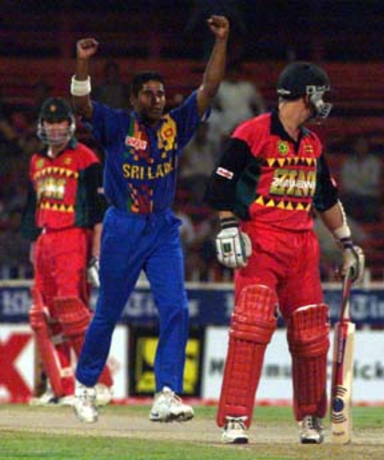 Chaminda Vaas claims a wicket at Sharjah, 25th October 2000