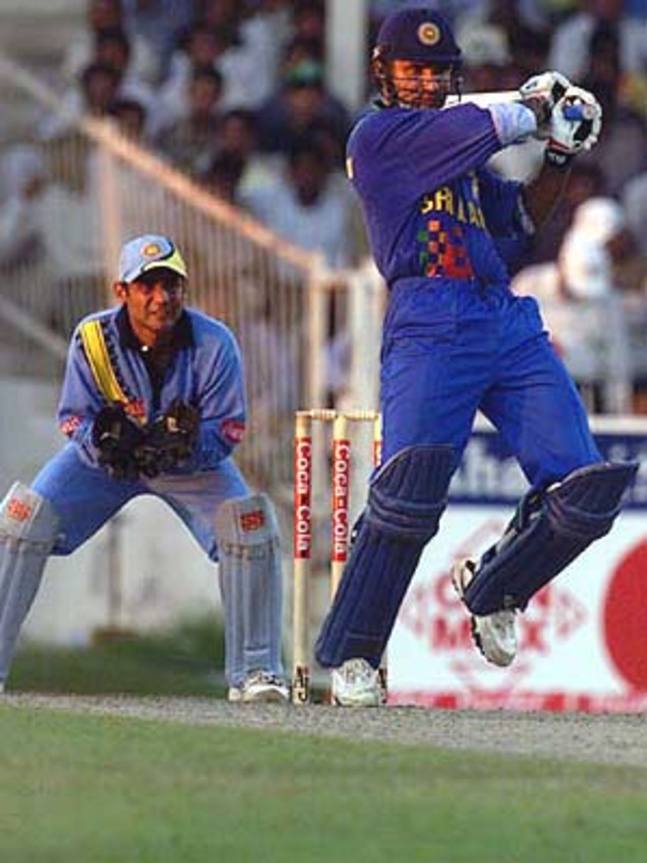 Atapattu forces the ball off the back foot as Dahiya watches keenly, Coca-Cola Champions Trophy, 2000/01, 6th Match, India v Sri Lanka, Sharjah C.A. Stadium, 27 October 2000.