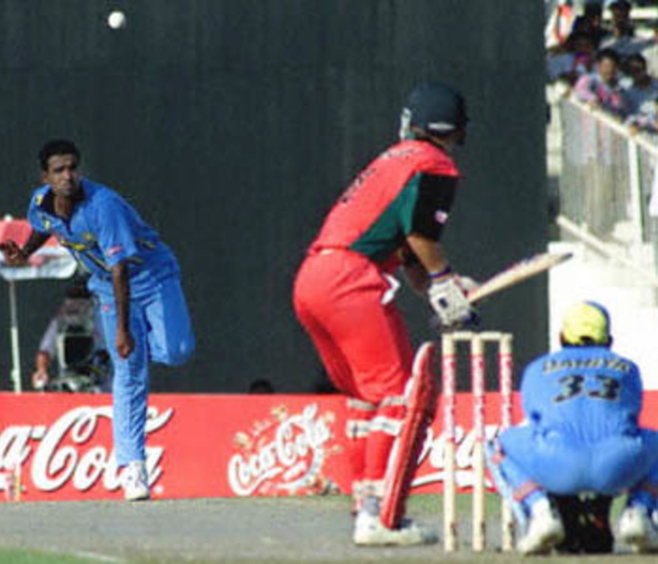 Sunil Joshi tosses a ball up to Paul Strang, Coca-Cola Champions Trophy, 2000/01, 5th Match, India v Zimbabwe, Sharjah C.A. Stadium, 26 October 2000.