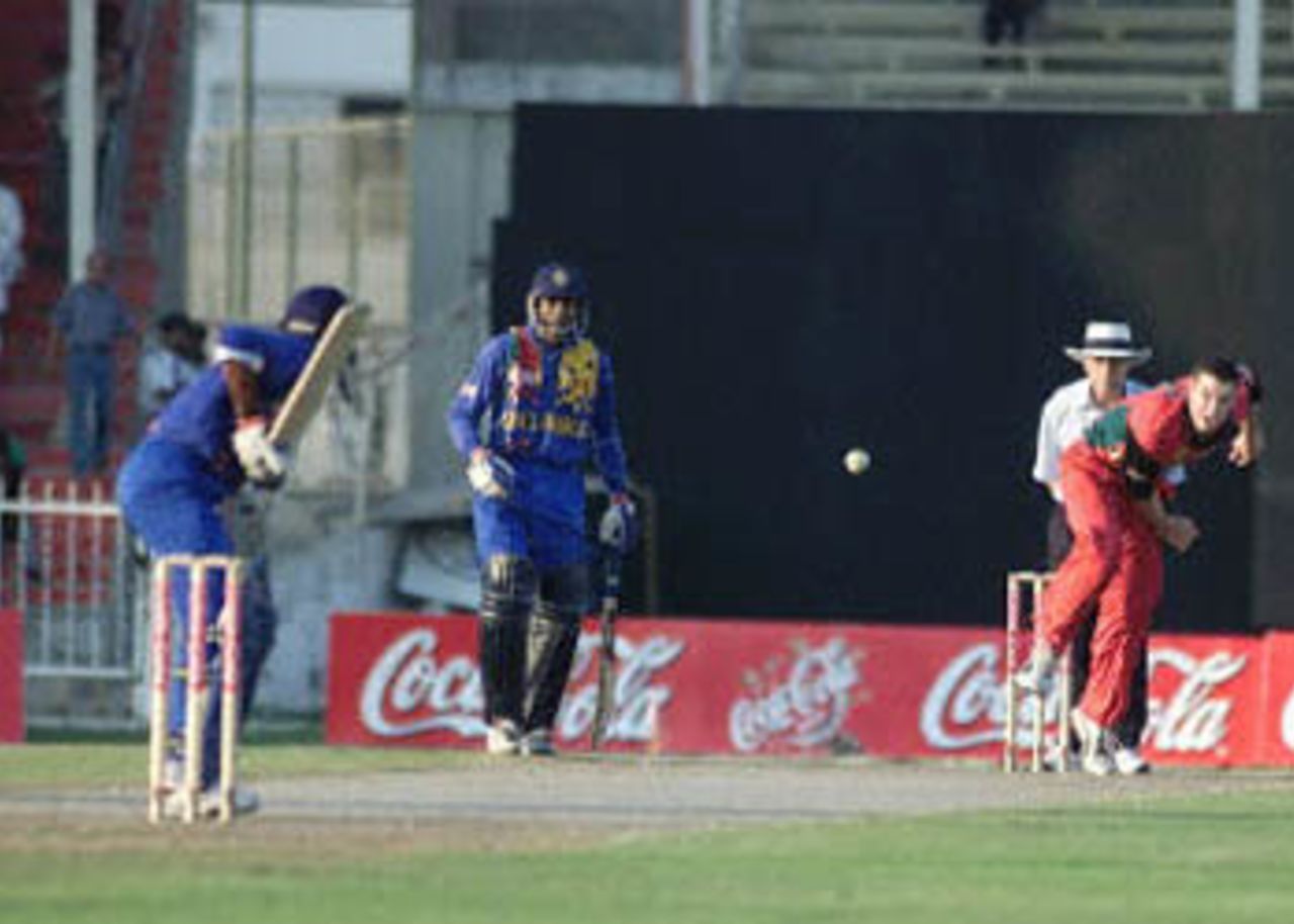 Atapattu commits himself for a shot as Arnold looks on, Coca-Cola Champions Trophy, 2000/01, 4th Match, Sri Lanka v Zimbabwe, Sharjah C.A. Stadium, 25 October 2000.