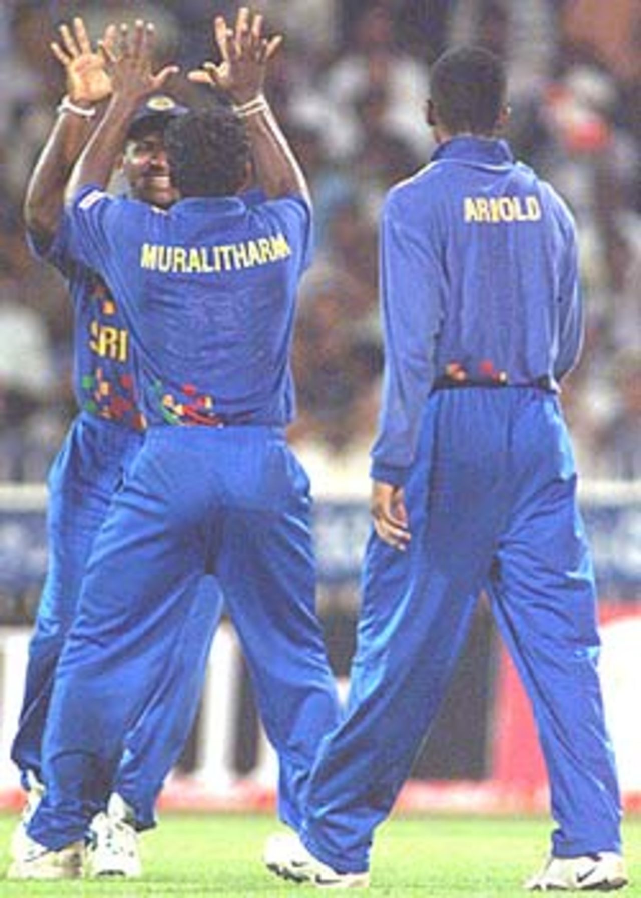 Murali celebrates after striking yet another lethal blow in his record breaking spell, Coca-Cola Champions Trophy, 2000/01, 6th Match, India v Sri Lanka, Sharjah C.A. Stadium, 27 October 2000.