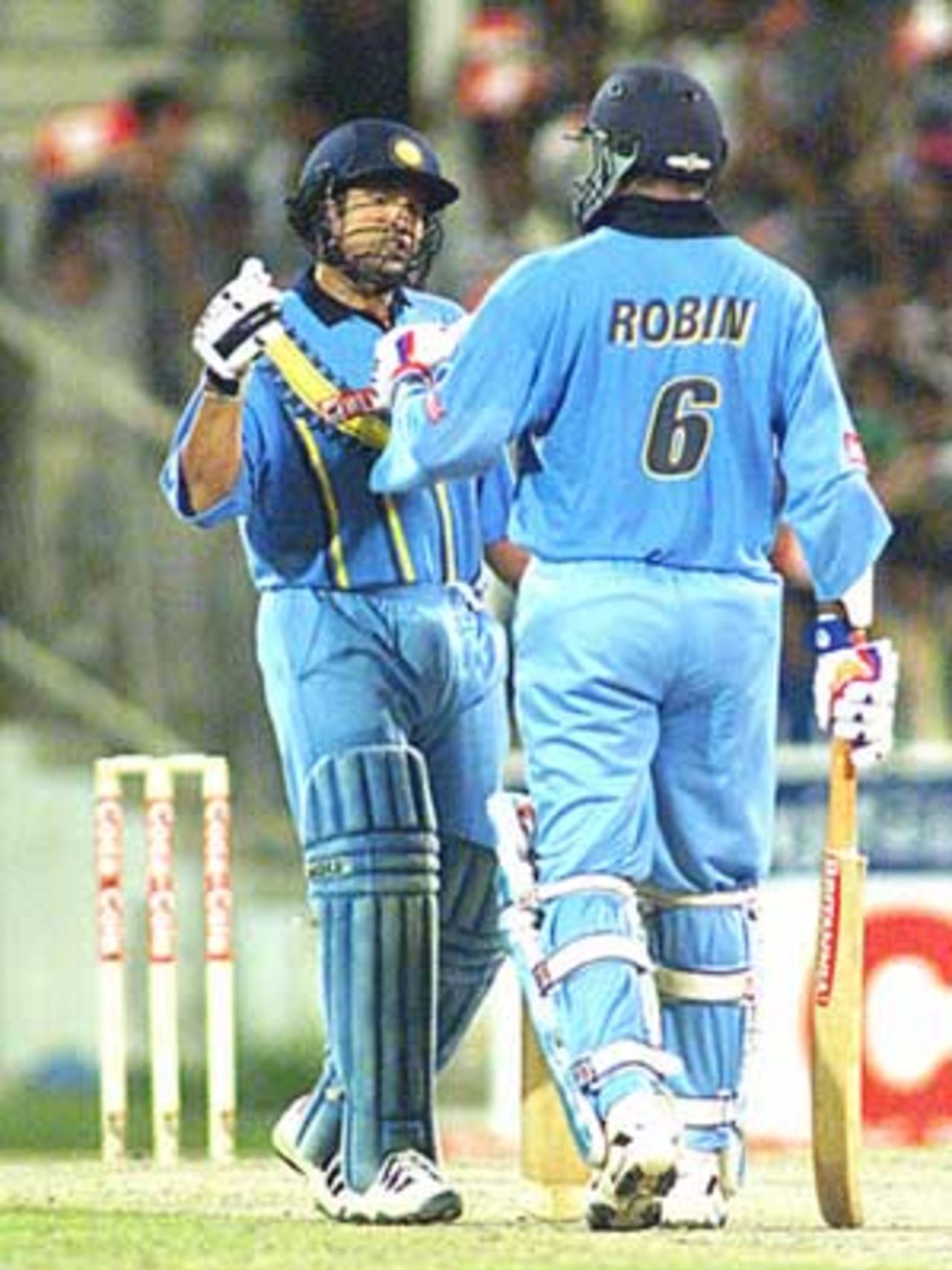 Robin Singh and Sachin Tendulkar meet mid pitch to try and chase the huge Lankan total, Coca-Cola Champions Trophy, 2000/01, 6th Match, India v Sri Lanka, Sharjah C.A. Stadium, 27 October 2000.