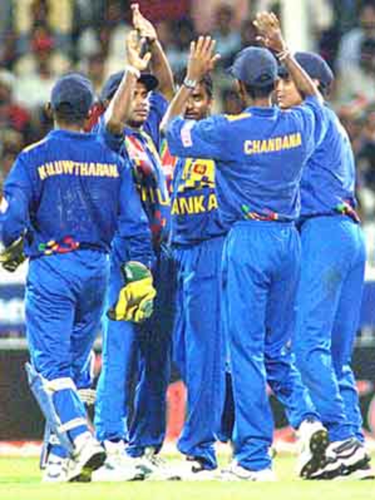 The Lankans are all smiles as yet another indian wicket falls, Coca-Cola Champions Trophy, 2000/01, 6th Match, India v Sri Lanka, Sharjah C.A. Stadium, 27 October 2000.