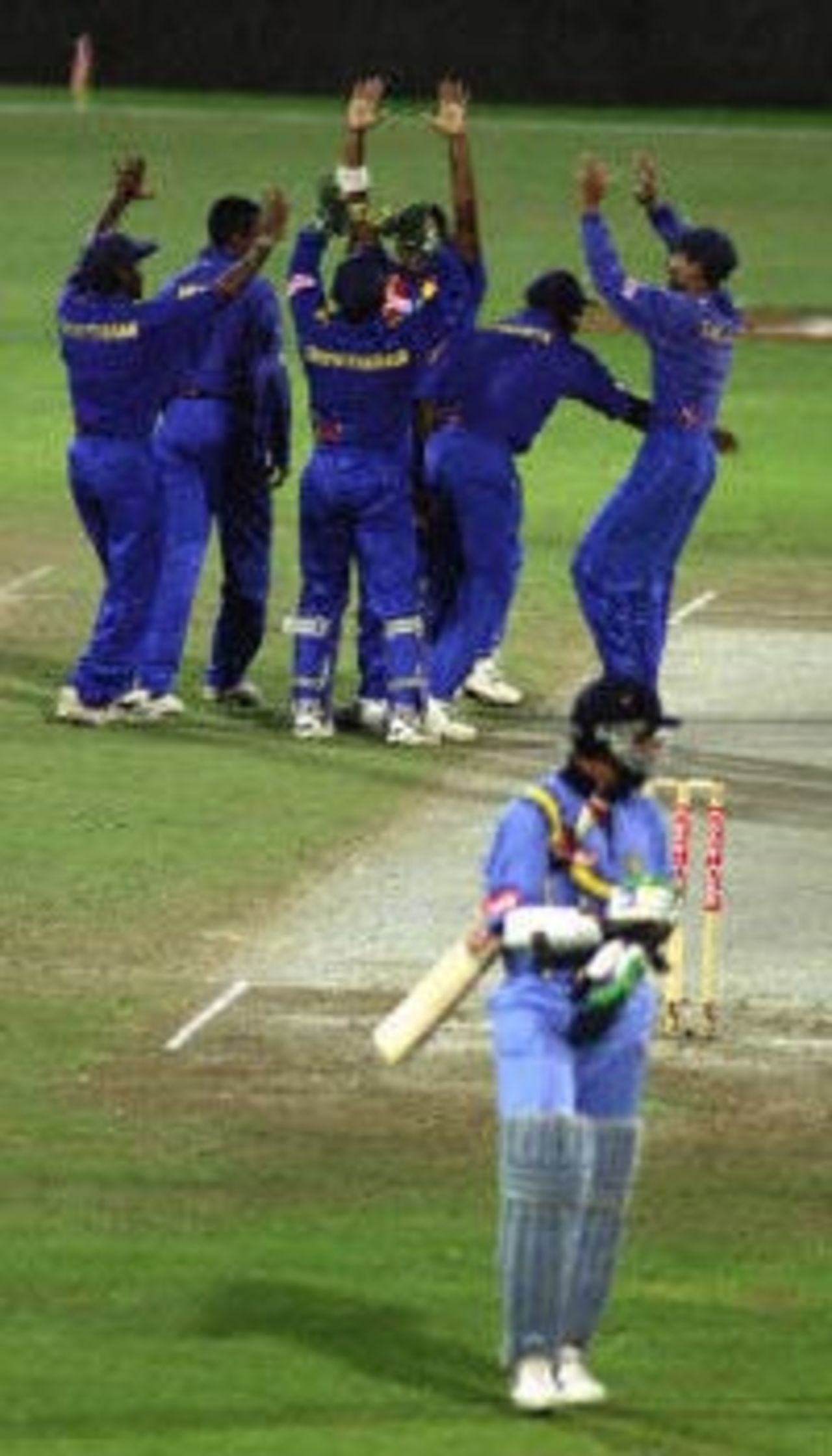 The Lankans celebrate the fall of a key wicket in their encounter against India, Coca-Cola Champions Trophy, 2000/01, 6th Match, India v Sri Lanka, Sharjah C.A. Stadium, 27 October 2000.
