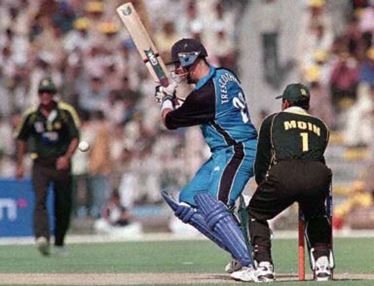 Trescothick flays the ball through the offside as Pakistani skipper Moin Khan watches, England in Pakistan, 2000/01, 2nd One-Day International, Pakistan v England, Gaddafi Stadium, Lahore, 27 October 2000.