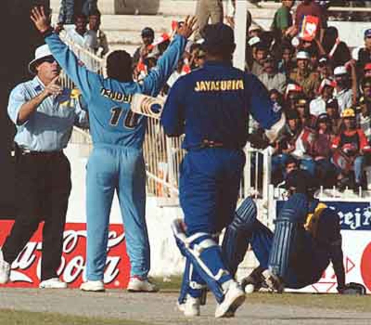 Tendulkar appealing after he fingers the straight drive from Jayasuriya to the wickets as Atapattu is run out, Coca-Cola Champions Trophy, 2000/01, Final, India v Sri Lanka, Sharjah C.A. Stadium, 29 October 2000.