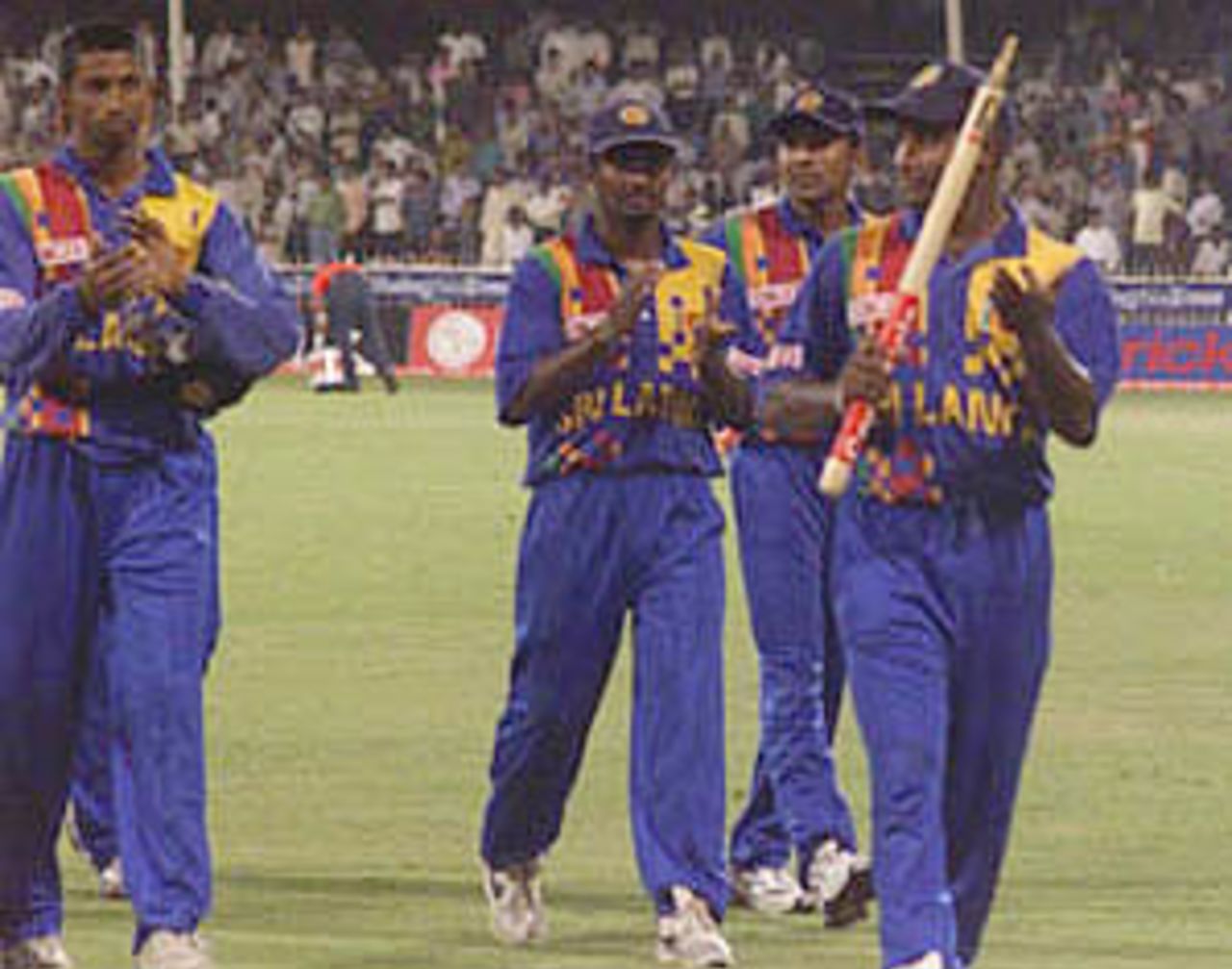 Jayasuriya leads back his team in after their stunning bowling display, Coca-Cola Champions Trophy, 2000/01, Final, India v Sri Lanka, Sharjah C.A. Stadium, 29 October 2000.