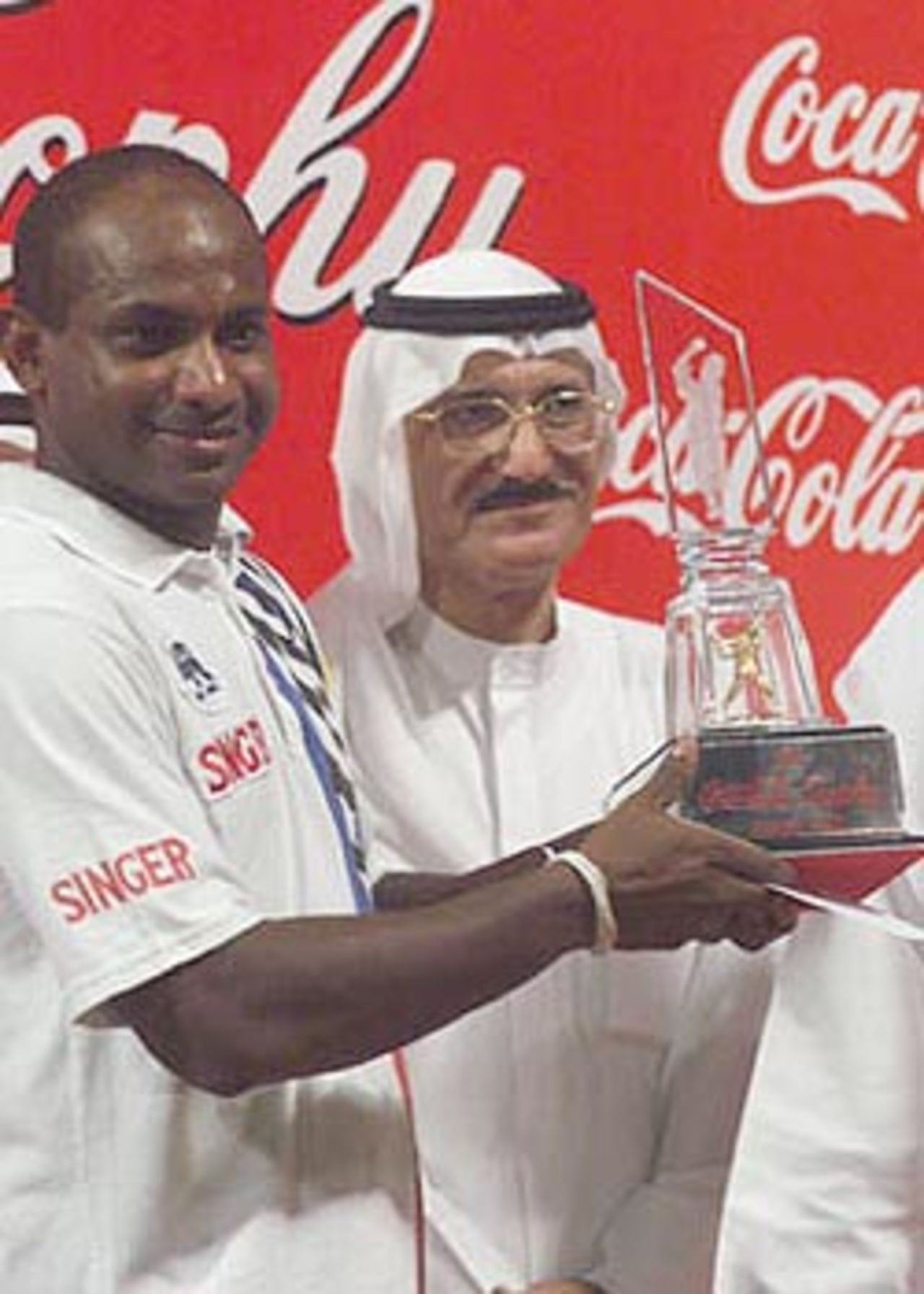 Jayasuriya receiving the Coca-Cola Trophy, Coca-Cola Champions Trophy, 2000/01, Final, India v Sri Lanka, Sharjah C.A. Stadium, 29 October 2000.
