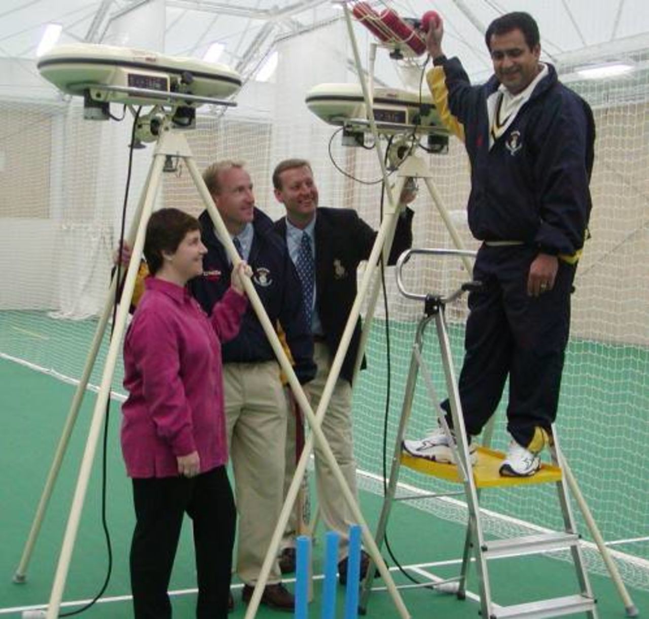BOLA machine being fed by Raj Maru as the group watch