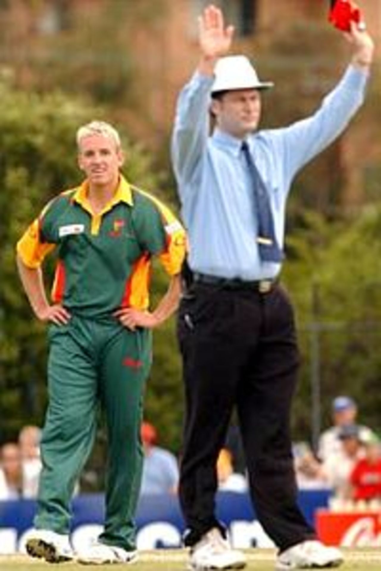 14 Oct 2001: Damien Wright #6 of the Tigers watches on as the umpire signals another six runs off his bowling during the ING One Day cricket match between the New South Wales Blues and the Tasmanian Tigers held at Bankstown Oval, Sydney, Australia.