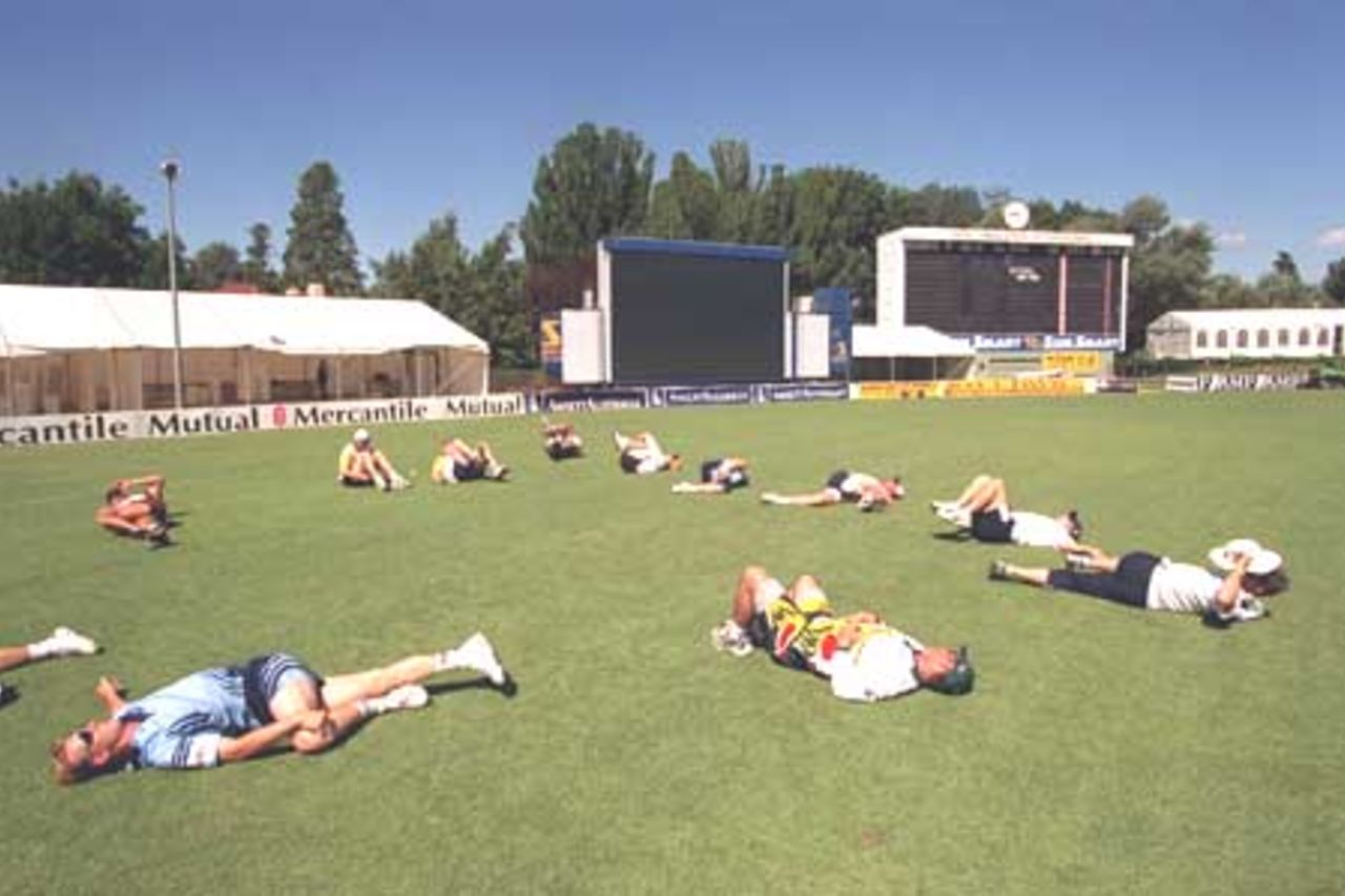 6 Dec 1999: Prime Ministers XI, cricket team stretches during training in preparation for the match tomorrow between India and the Prime Ministers X1 at Manuka Oval Canberra, Canberra, Australia.
