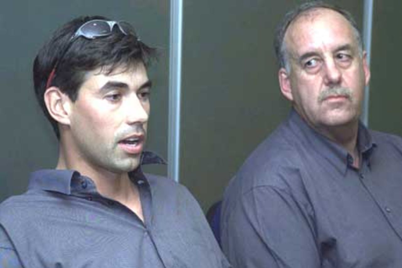 13 Oct 2001: Stephen Fleming (L) of New Zealand chats to the media while coach Denis Aberhart looks on during a press conference held at the Brisbane International Airport to begin the Cricket Test Tour of Australia.