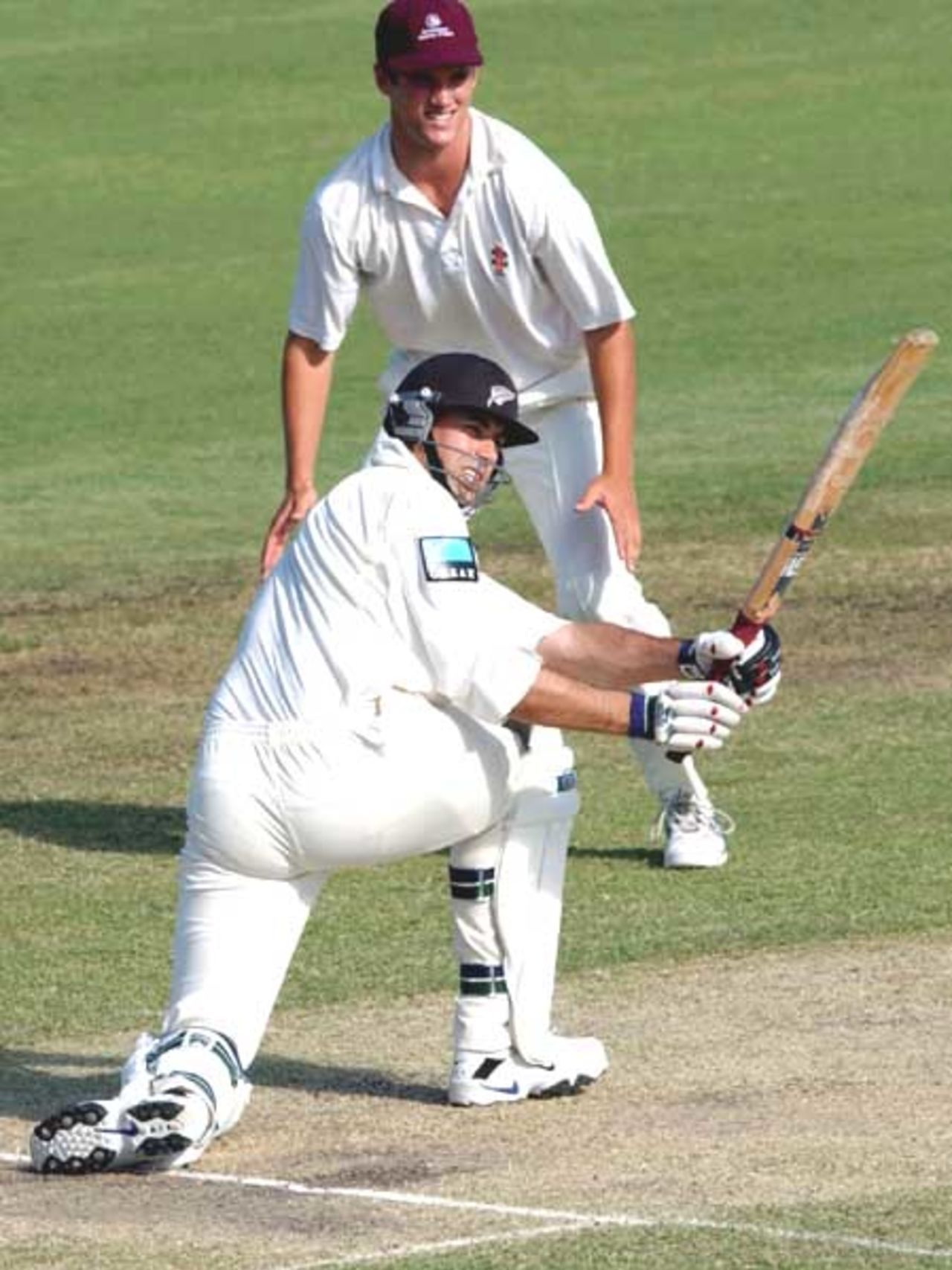 16 Oct 2001: Stephen Fleming of New Zealand plays a sweep shot during the New Zealand Cricket team's tour match against the Queensland Academy of Sport XI which is being played at Allan Border Field in Brisbane, Australia.