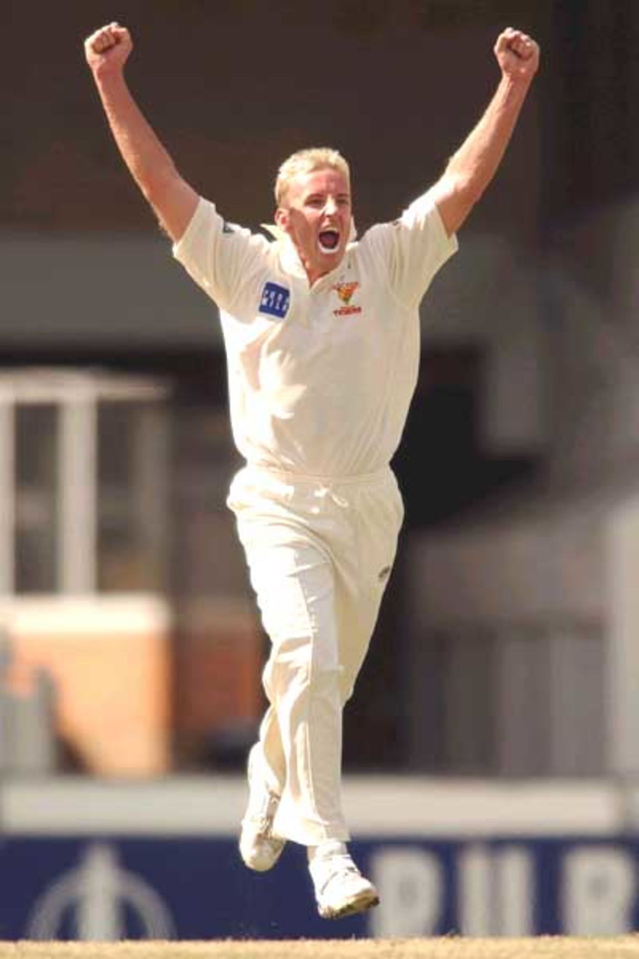 18 Oct 2001: Damien Wright of the Tigers celebrates taking the wicket of Michael Slater of the Blues during day two of the Pura Cup cricket match between the New South Wales Blues and the Tasmanian Tigers held at the Sydney Cricket Ground, Sydney, Australia.