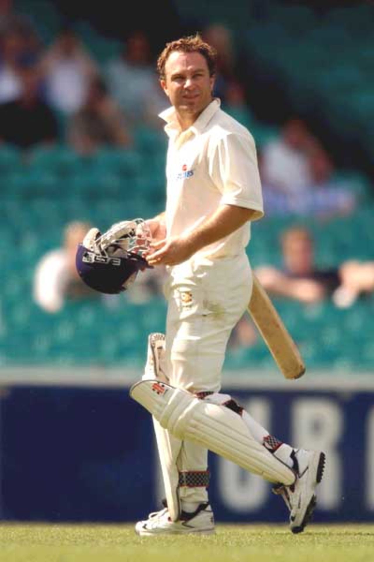 18 Oct 2001: Michael Slater of the Blues leaves the ground after being caught for 19 by Ricky Ponting of the Tigers during day two of the Pura Milk Cup cricket match between the New South Wales Blues and the Tasmanian Tigers held at the Sydney Cricket Ground, Sydney, Australia.