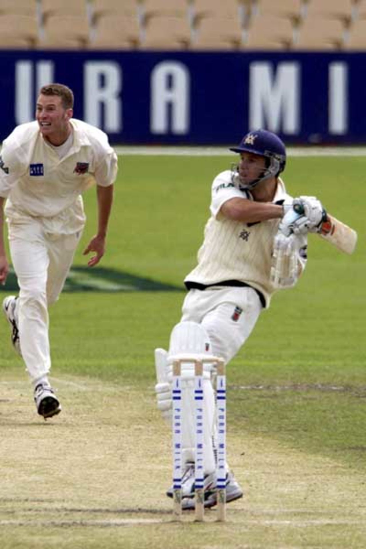 18 Oct 2001: Victorian batsman Brad Hodge watches the flight of his shot for 4 off Paul Rofe in the Pura Cup match between the Southern Redbacks and the Victoria Bushrangers played at Adelaide Oval, Adelaide, Australia.