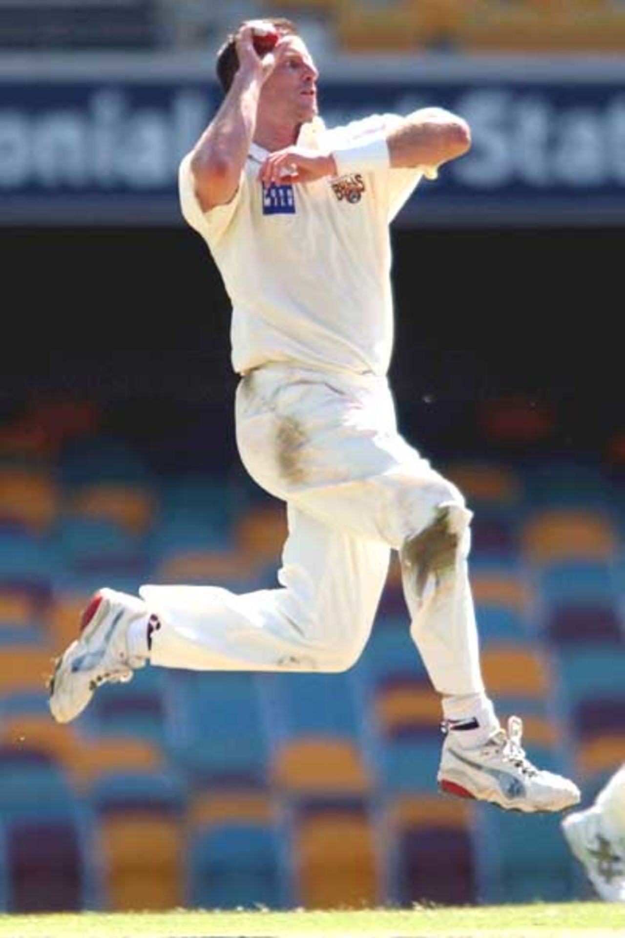 18 Oct 2001: Michael Kasprowicz of Queensland in action against Western Australia during the Pura Cup cricket match between Queensland and Western Australia which is being played at the Gabba in Brisbane, Australia.