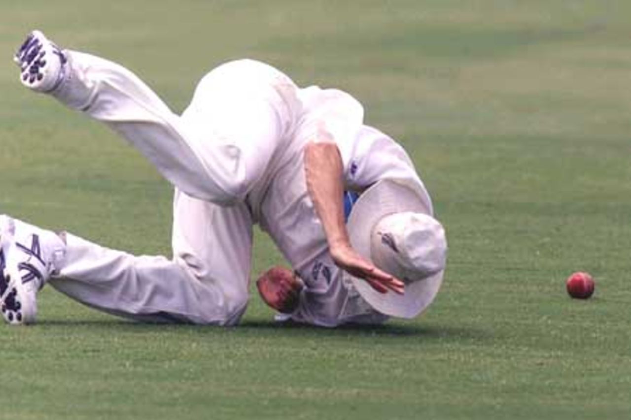 18 Oct 2001: Chris Martin of New Zealand attempts to field the ball during the match between New Zealand and the Queensland XI played at the Allan Border Field, Brisbane, Australia.